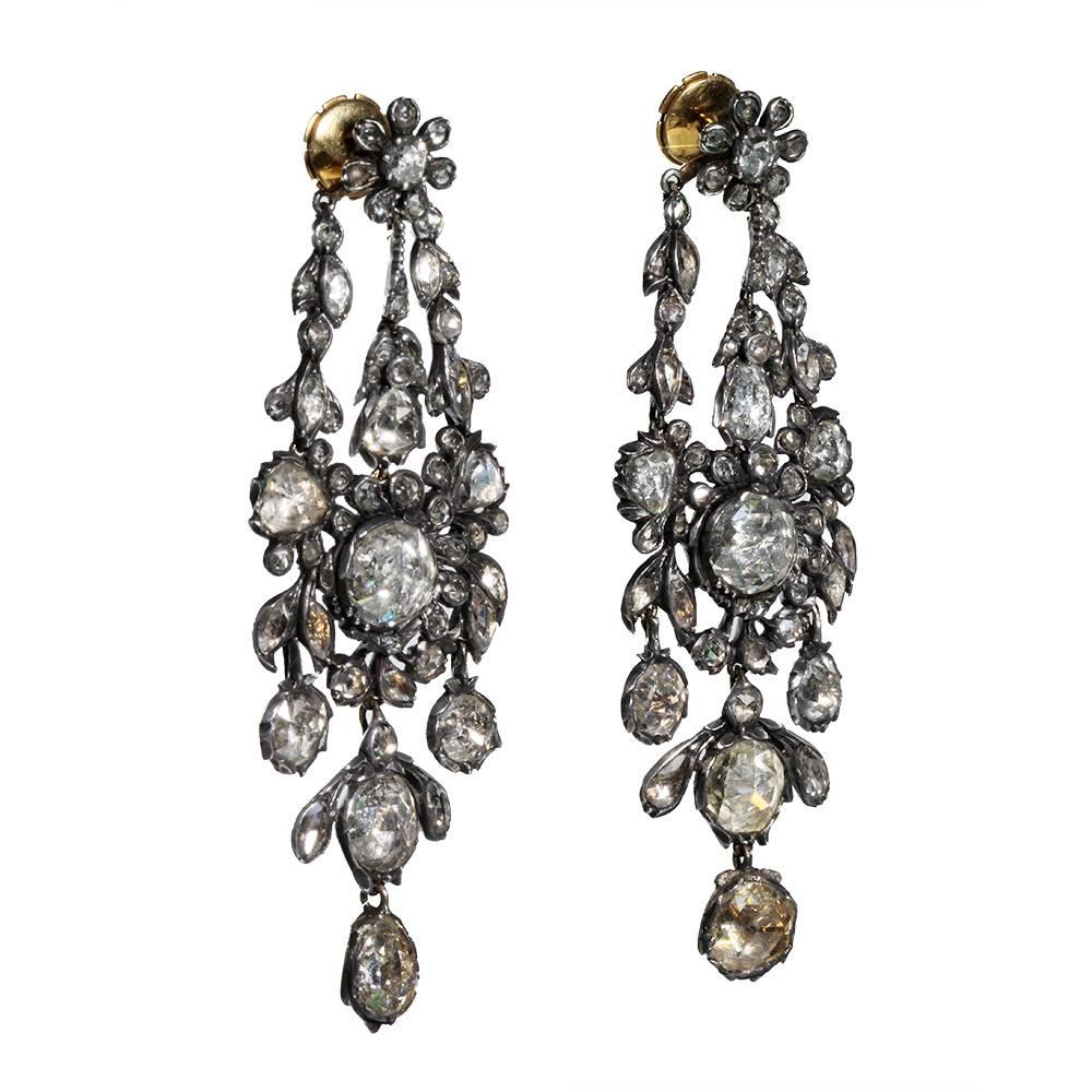 Wonderful large 19th century diamond earrings. In silver & gold with rose cut diamonds. The foil backing of the diamonds are bright and lively in all settings. Circa 1850, marked with French markers' marks.

3