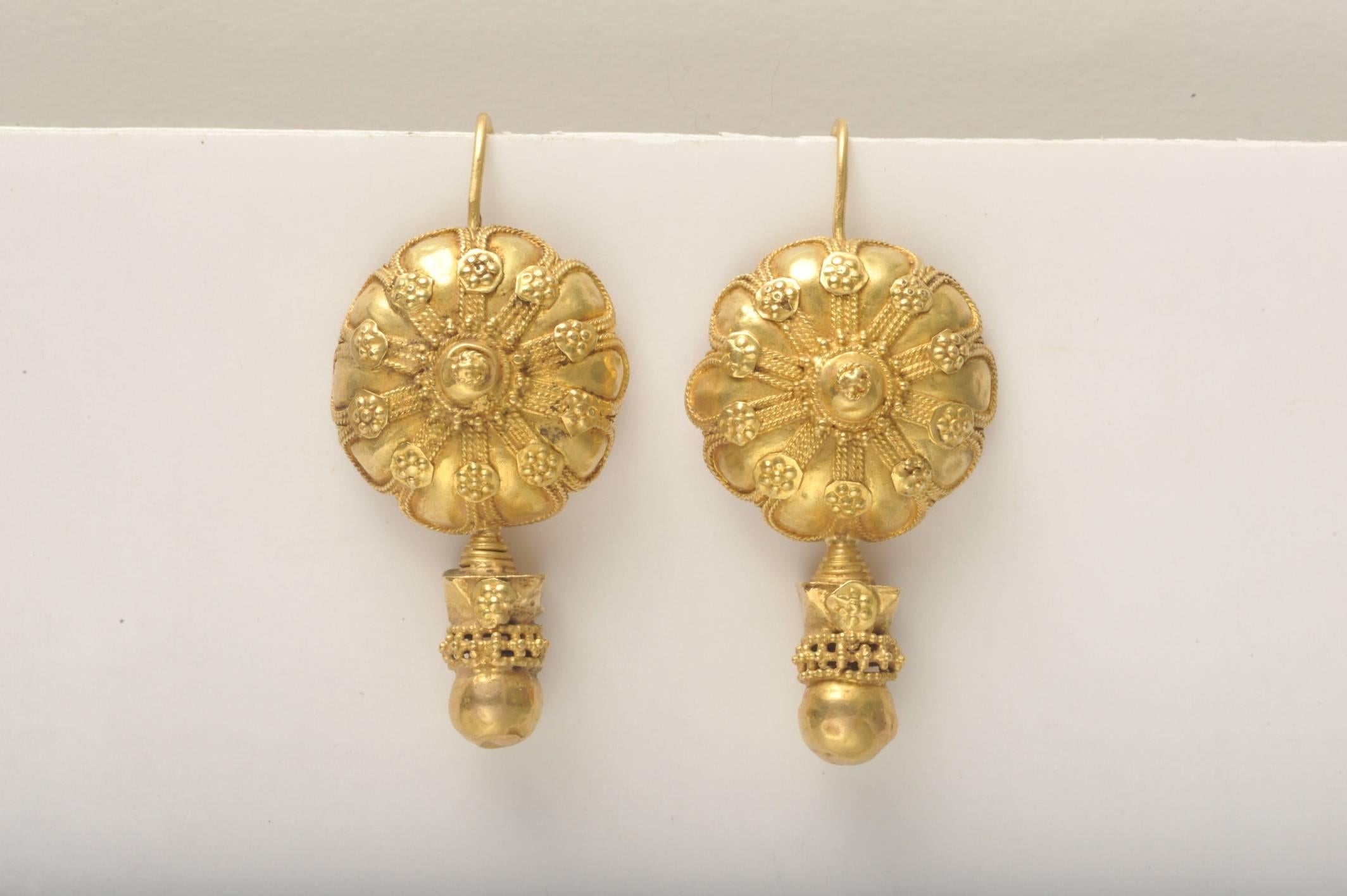 This pair of earrings is rare and exceptional.  From the early 1900's India, 22K gold with incredibly fine granulation work.  Long earring wire has been filed down to accommodate smaller Westernized ear piercings.  These are a rare find.