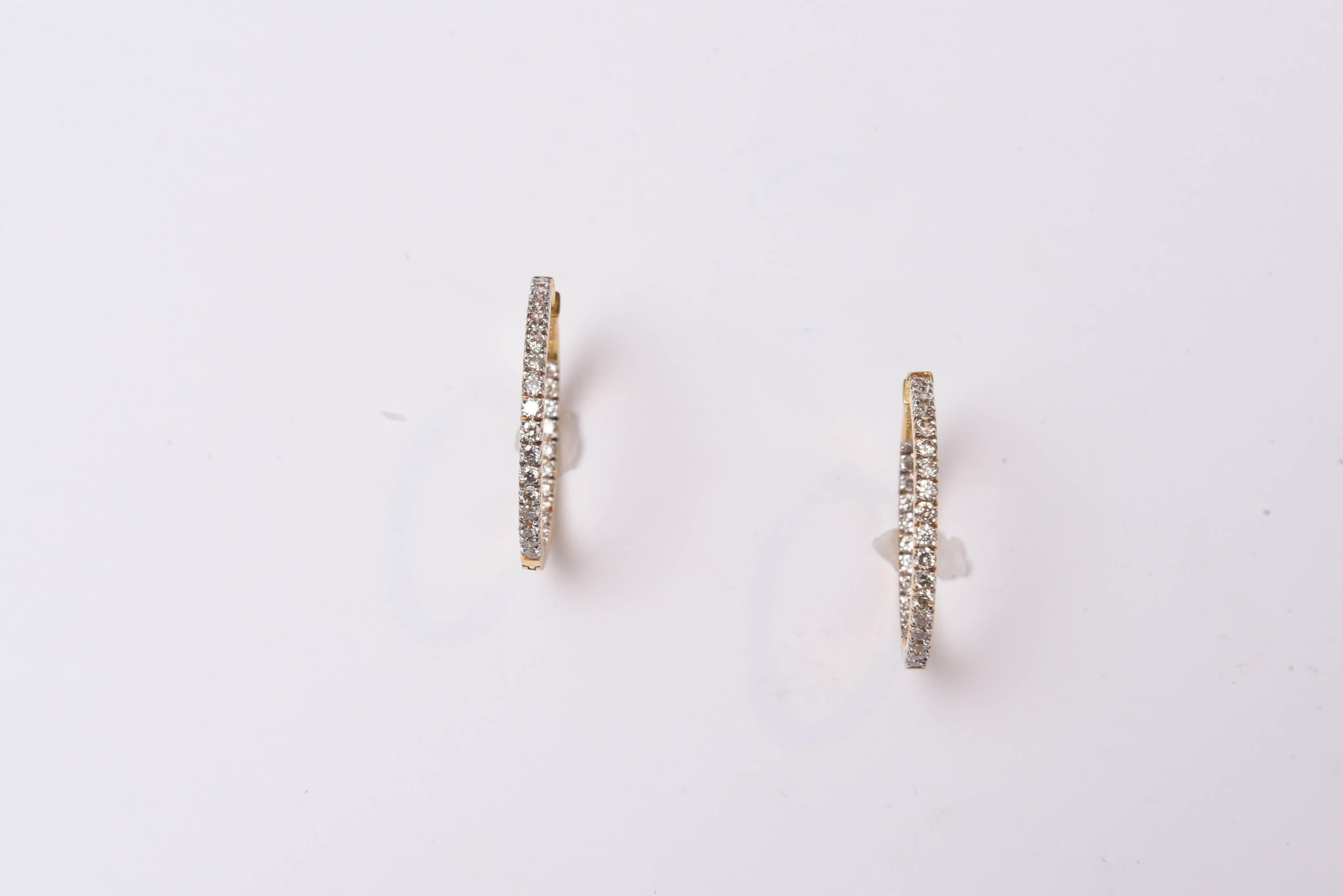Lovely and classic 18K gold inside out hoops with diamonds set both along the front of the hoop and on the inside for a double row and dimensional affect of diamonds as you wear them.  Nice push clasp closure for pierced ears.  2.8 carats of diamonds