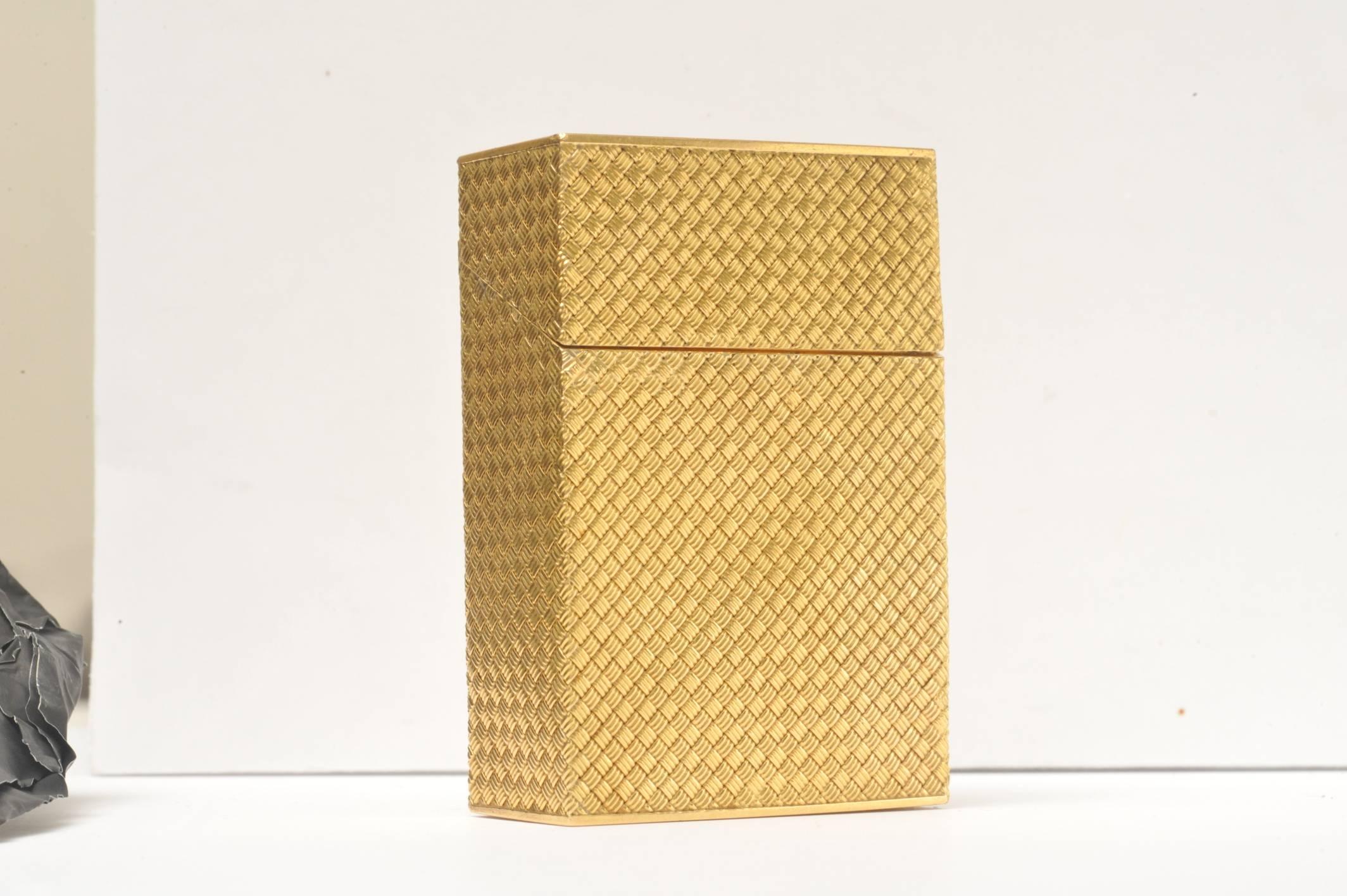 This solid 18K gold cigarette box in the basket weave design is a truly stunning piece.  The granulation work and detail is magnificent reminiscent of a bygone era.

Signature is there, but difficult to read.