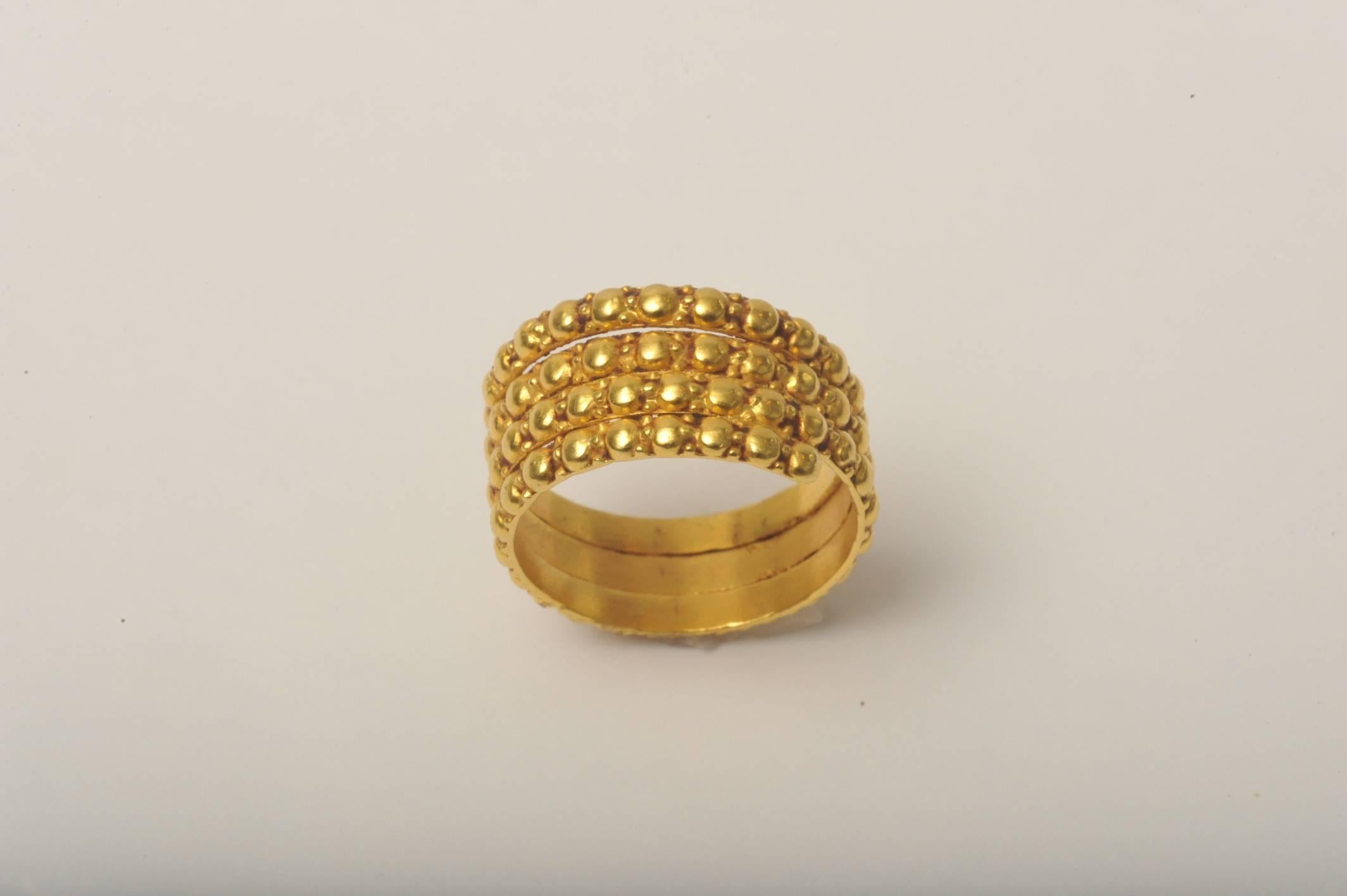 Exquisitely hand crafted 22K gold coil ring with fine granulation work which offers a textured look.  Size is 7.5 with flexibility.