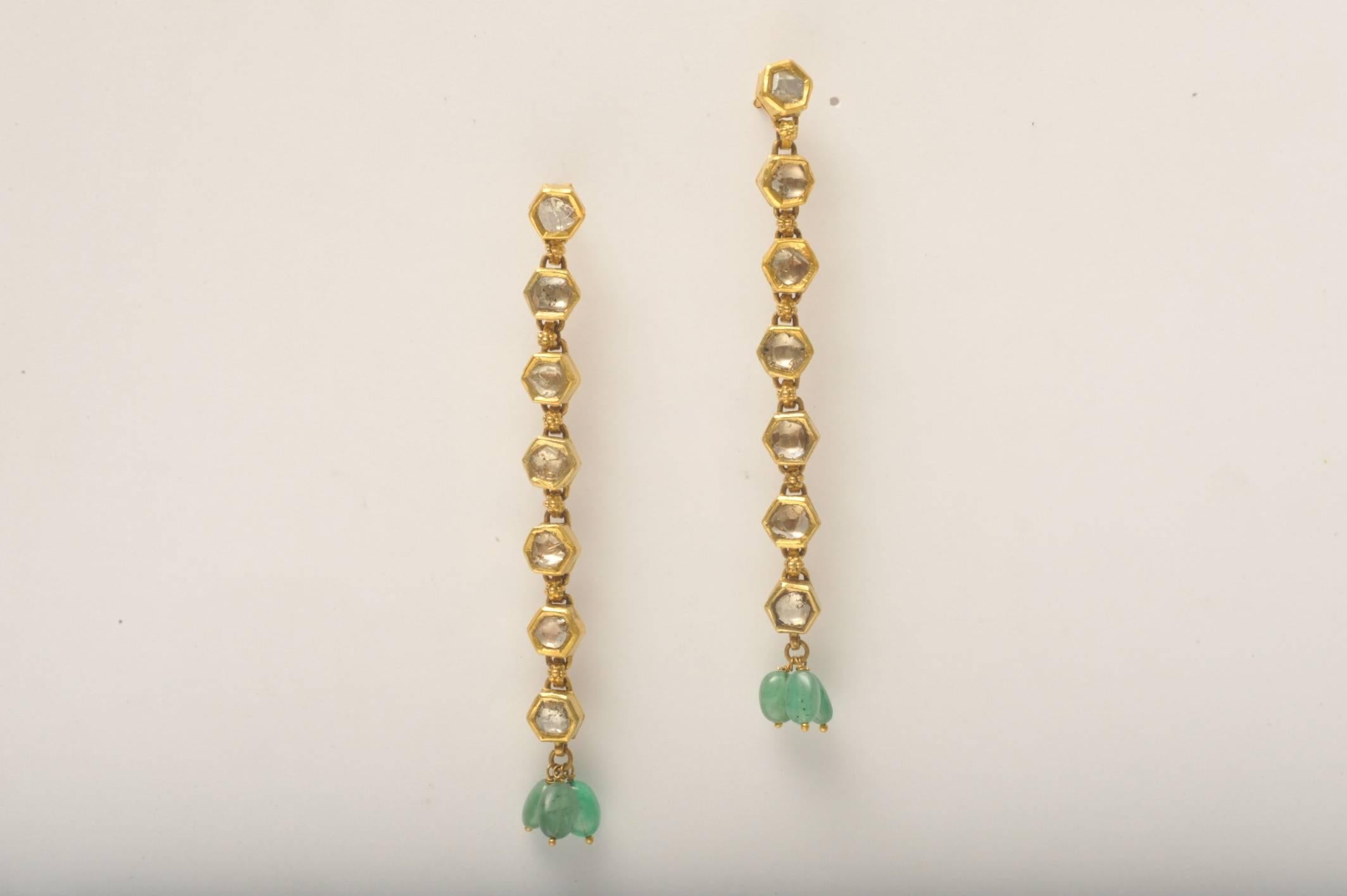 An exquisite pair of 7 rose cut diamonds per earring set in 22K gold with 3 tumbled emeralds at the bottom.  22K gold post for pierced ears.  Indian

