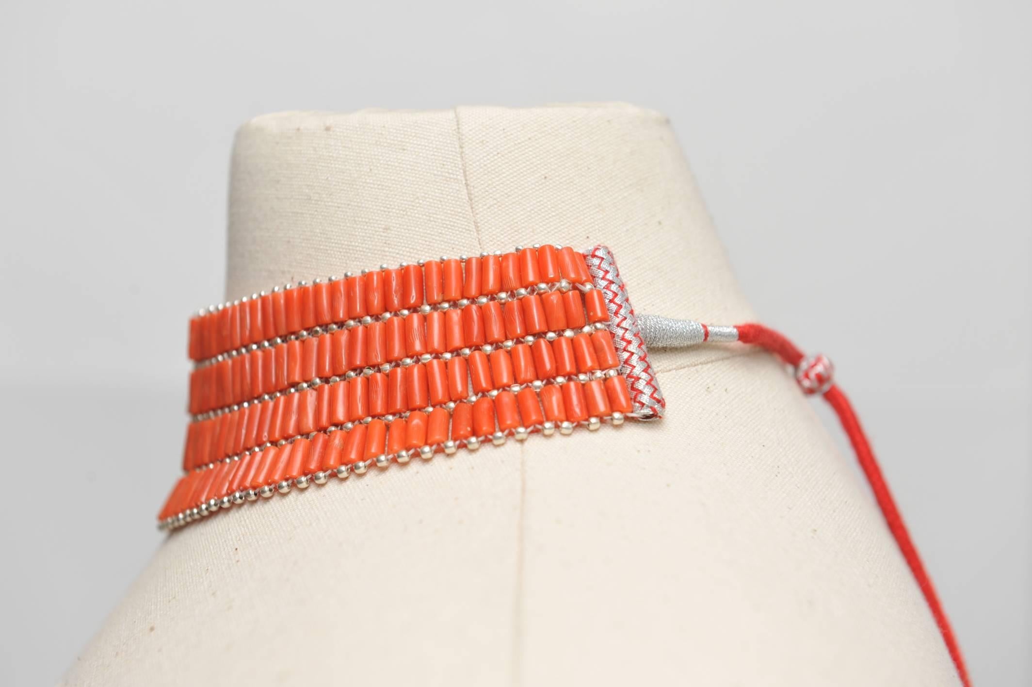 Fabulous choker made of natural coral and sterling silver with an adjustable slide and coral tassel at the bottom.

The Lockhart Collection located on Nantucket Island