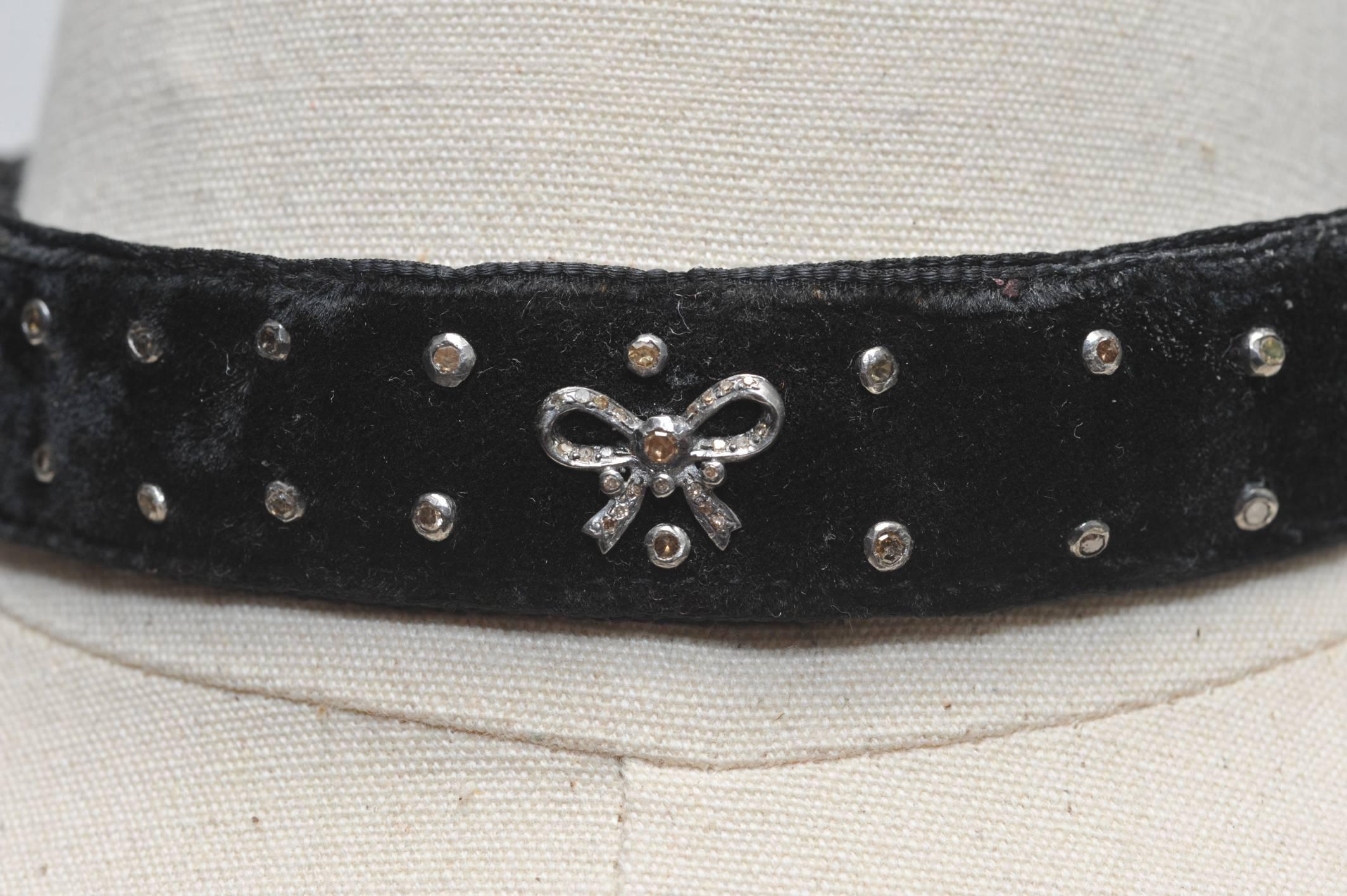 Sexy and cool black velvet choker with inset diamond studs and bows in oxidized sterling silver.  Rows of diamonds on the back bar closure and pave`-set diamonds on the lobster claw clasp and ring at the back.  The inside is black velvet and the