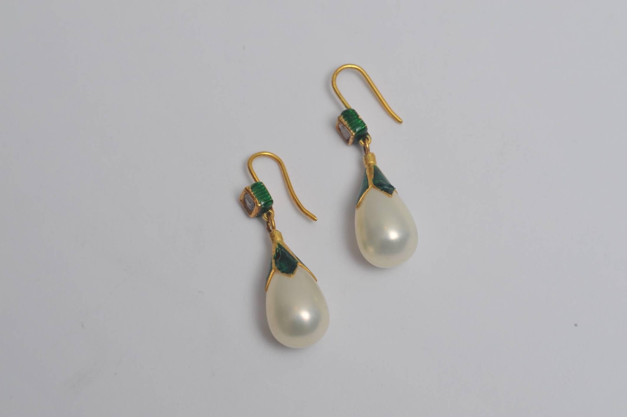 Pear-shaped pearls with 22K gold and square rosecut diamonds; all accented with green enamel.  Very unusual and not your grandmother's pearl earrings.