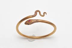 18K Gold Snake Bracelet with Pave` Diamonds, Ruby and Sapphire Eyes