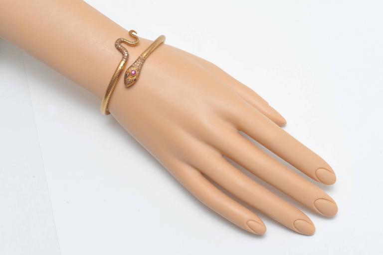 18K Gold Snake Bracelet with Pave` Diamonds, Ruby and Sapphire Eyes at