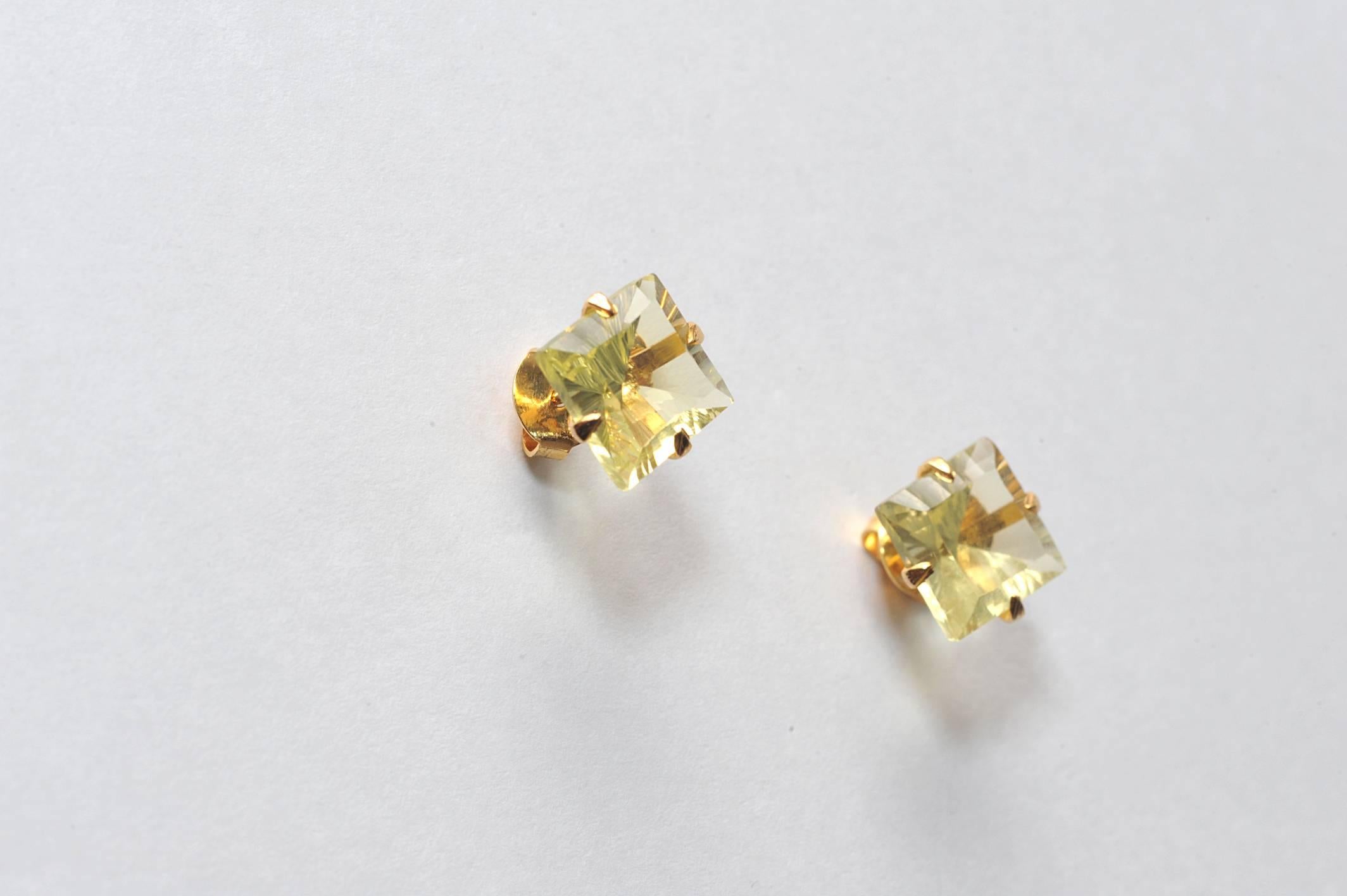 Stunning square-cut faceted yellow topaz studs set in 18K gold.....a fabulous find for those with November birthdays.  Carat weight is 5 ct and the stones have a finely faceted cut along the border and nice clarity.  For pierced ears.