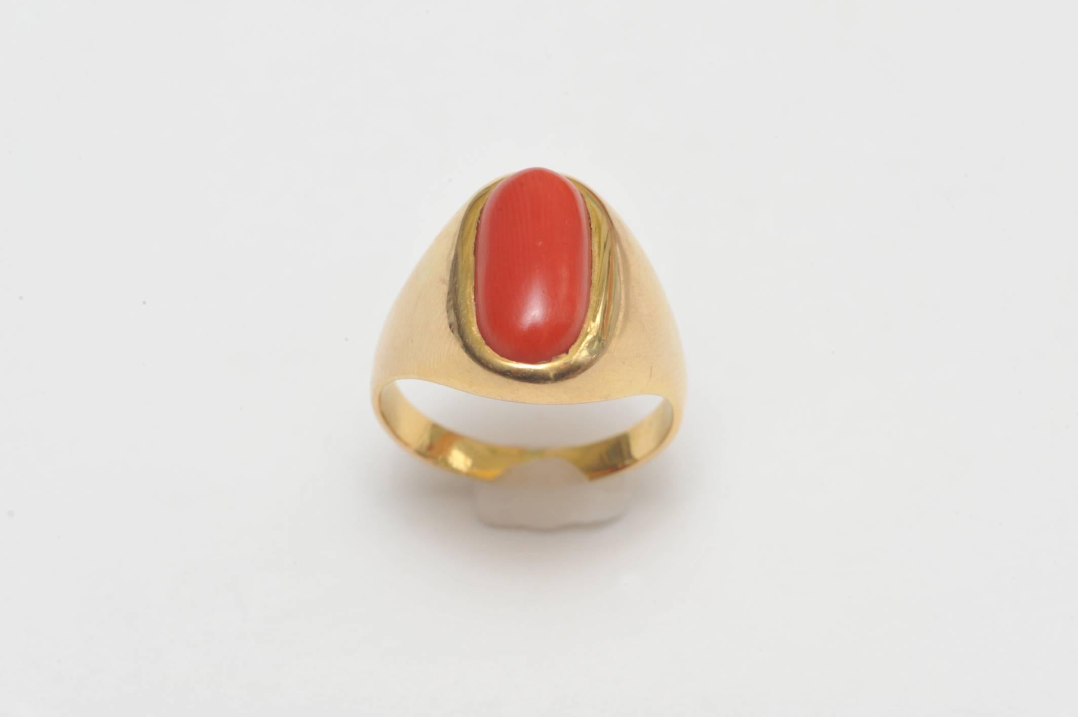 Classic styling with this lovely Italian cabochon coral stone and 18K gold ring.  Nice size and scale with a simple elegance.  Mid 20th C.  Ring size is 8.75.