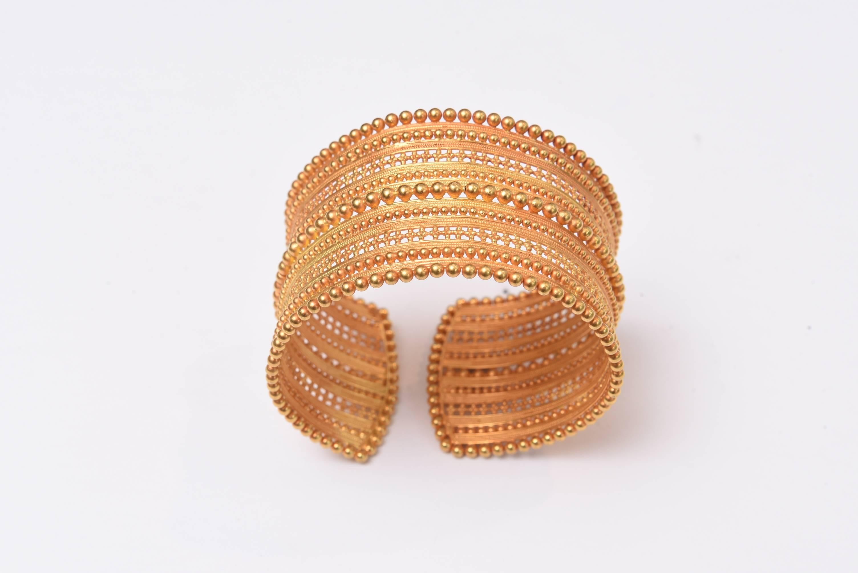 This cuff bracelet is rare and exceptional for not only the high karat 22K gold but the fine granulation work.  It has some flexibility so really fits all wrists.  Hand made, C. 1970's, Indian.  Inside circumference is 6.75 inches.