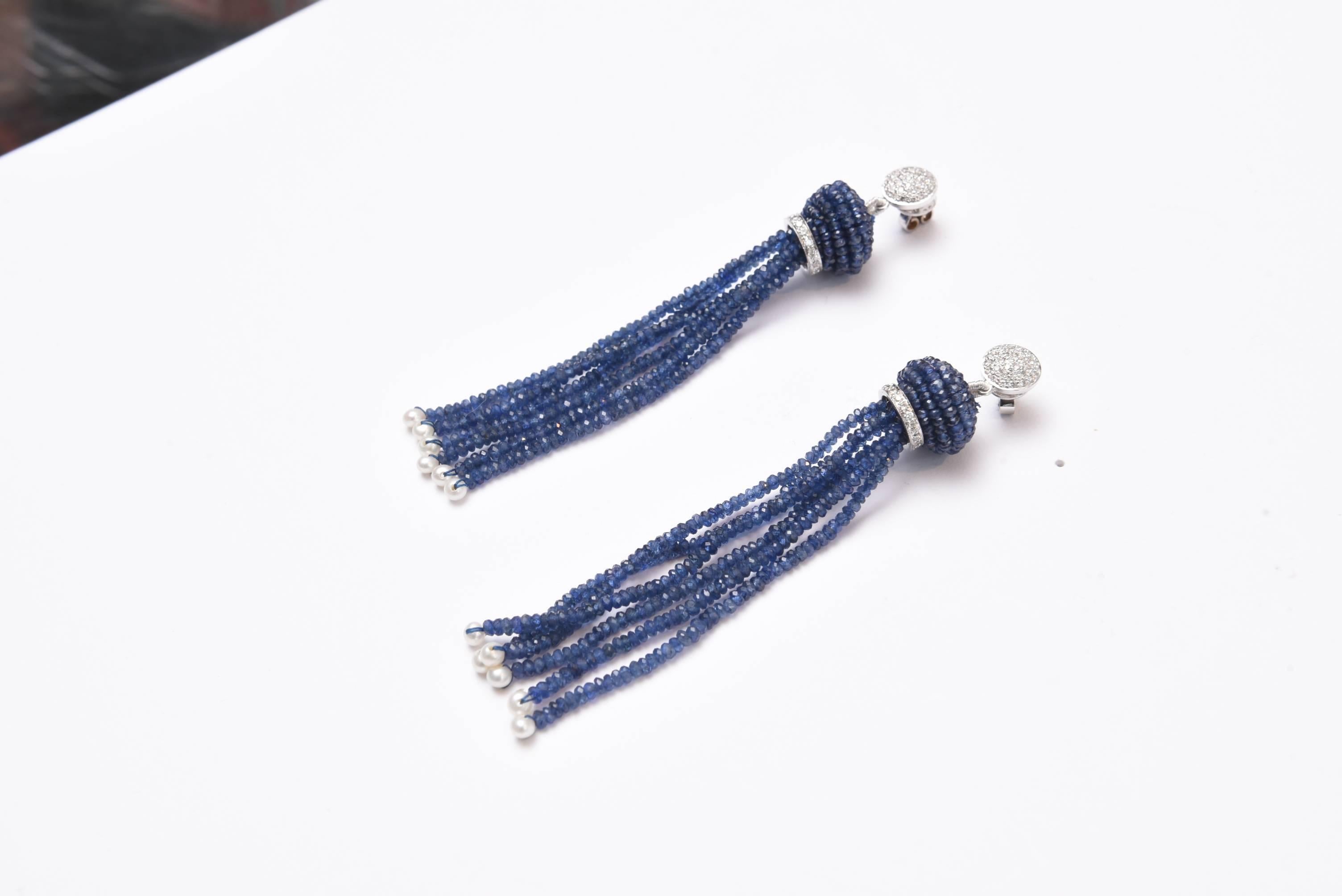 Lovely pair of tassel earrings with faceted brilliant blue sapphires with seed pearls at the bottom.  18K white gold and pave` diamond posts for pierced ears and a diamond and gold rondel at the top of the tassel.   Stunning.