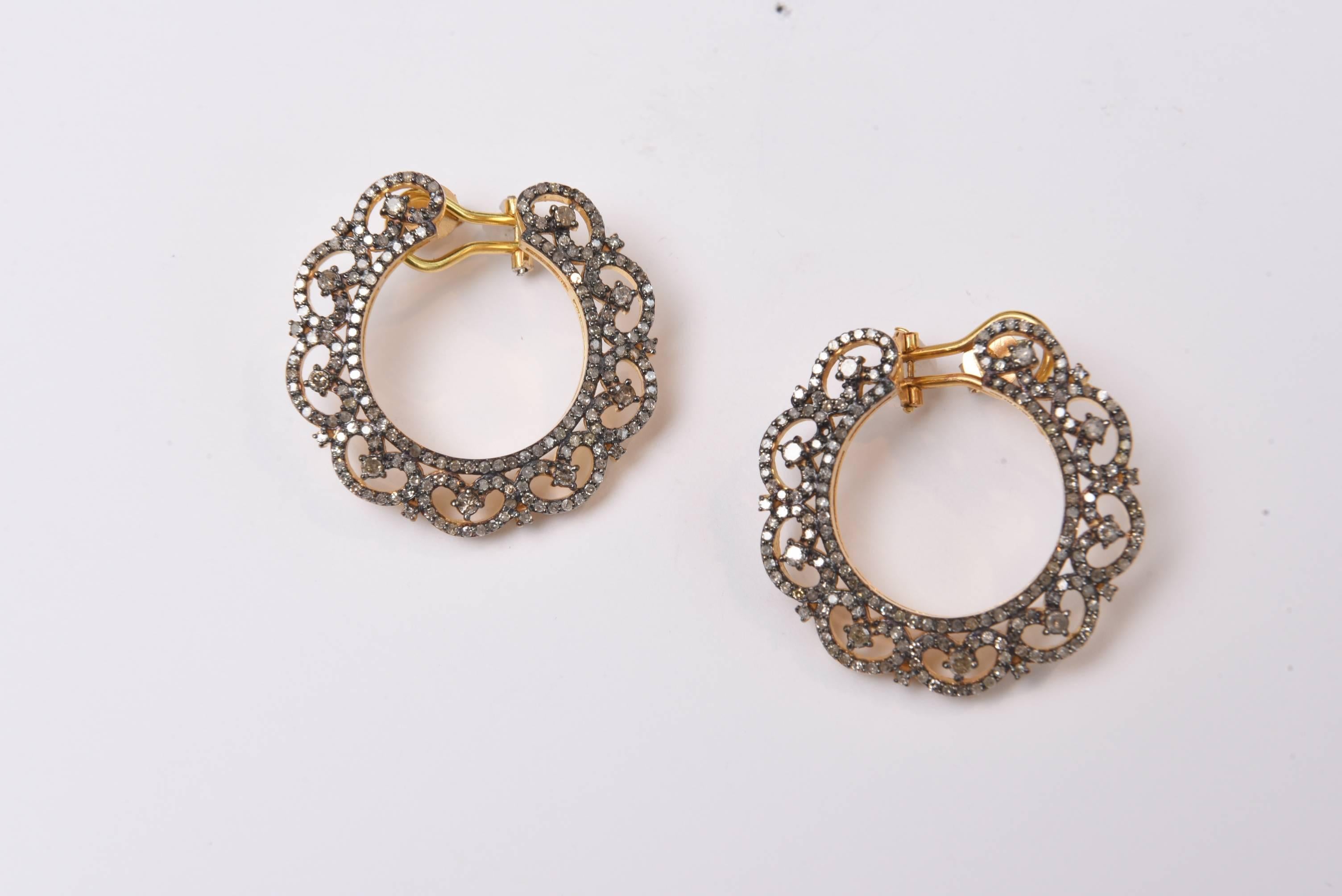Pair of diamond wreath earrings set in 18K gold over sterling silver.  Omega back is 18K gold for pierced ears.  Carat weight is 2.74.