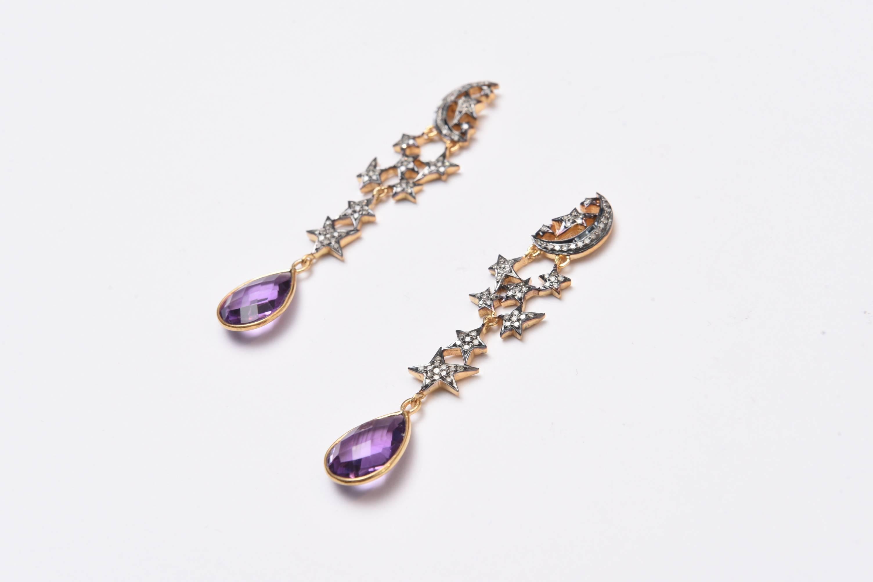 Fun and whimsical diamond moon and stars with pear-shaped faceted amethyst at the bottom.  18K gold posts, diamonds set in oxidized sterling and post is for pierced ears.  Diamond weight is .97; amethysts are 8.40 carats.