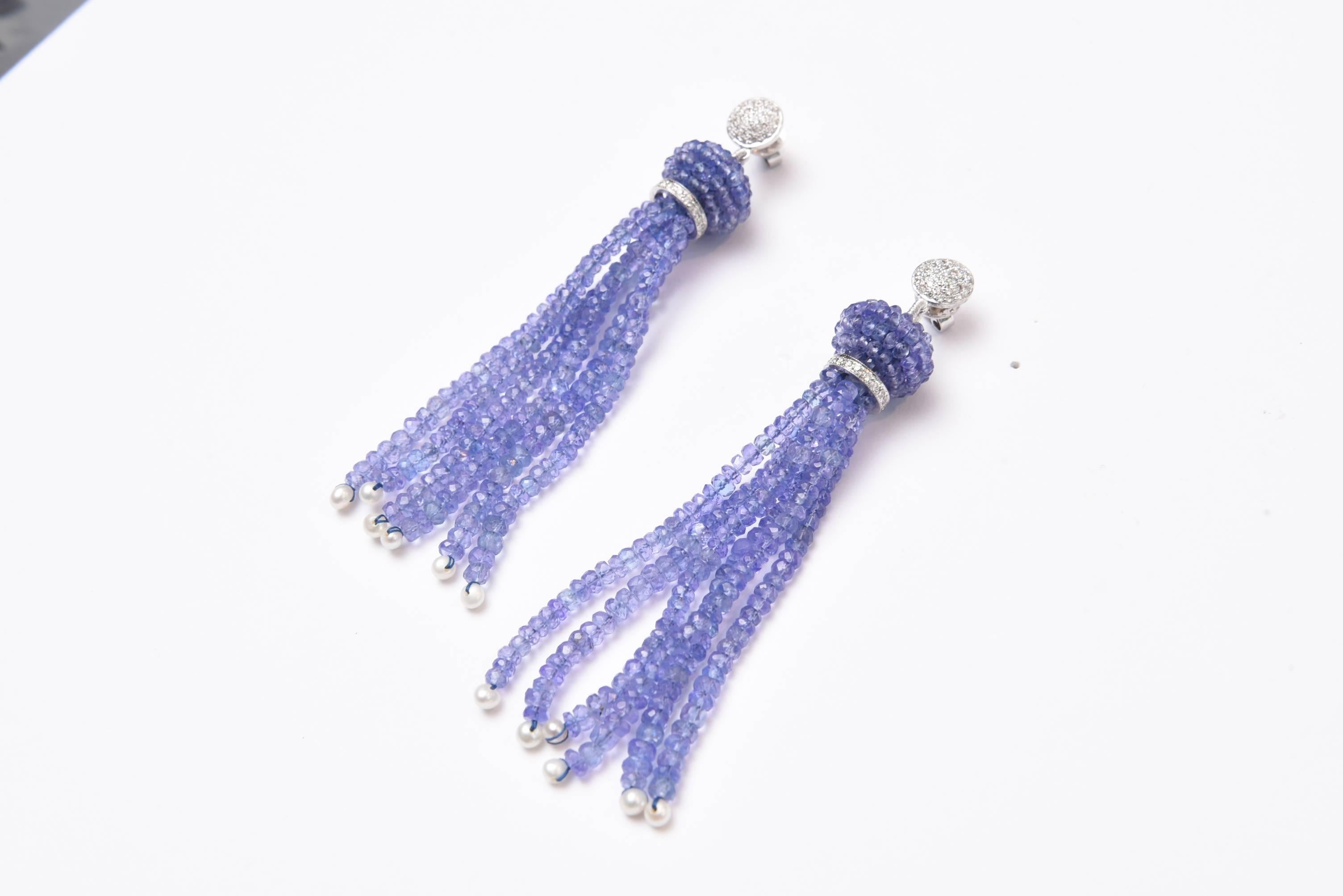 Lovely faceted tanzanite tassel earrings with seed pearls at the bottom, 18K gold diamond rondells and diamond earring studs, for pierced ears.  