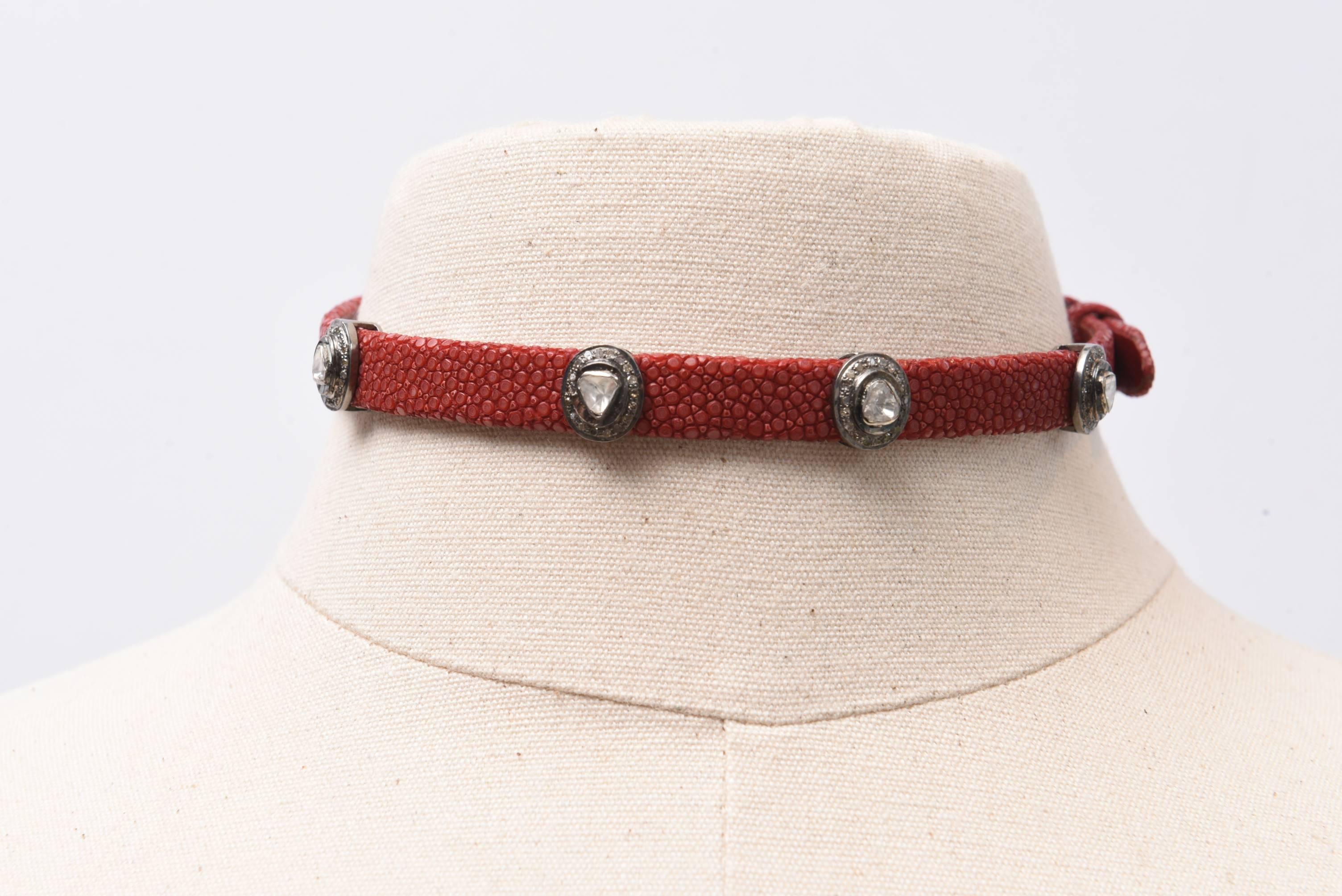 A bit on the edge this one.   A maroon shagreen (sting ray)  choker with buckle (adjustable) with rosecut and pave` diamonds interspersed--four altogether which you can move around.  Sterling buckle which you can feature or not.  Diamond weight is