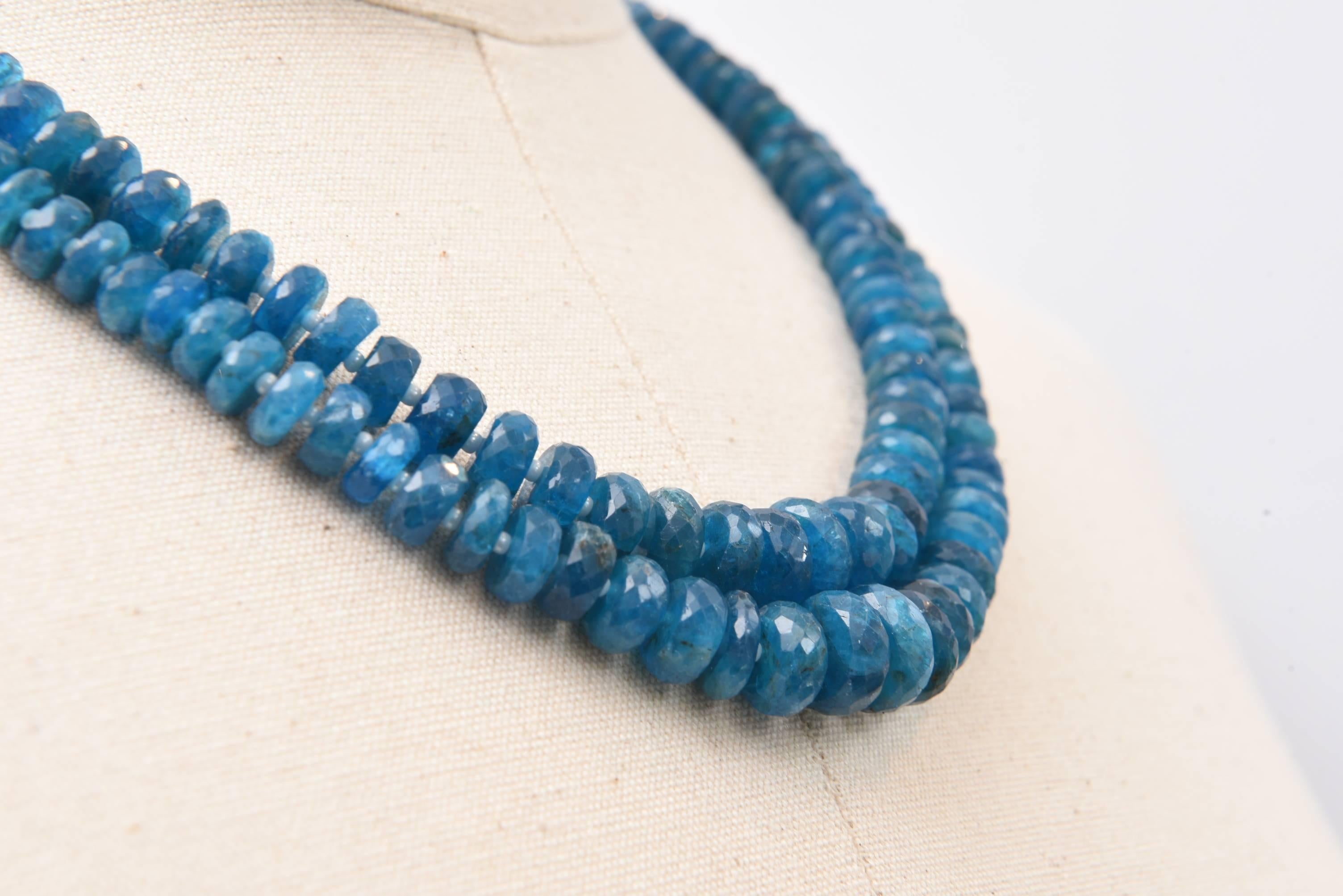 A double strand of faceted natural apatite beads separated by seed pearls.  The beads are slightly graduated ending with a sterling silver lobster claw clasp and extra silver chain to vary the length from 18