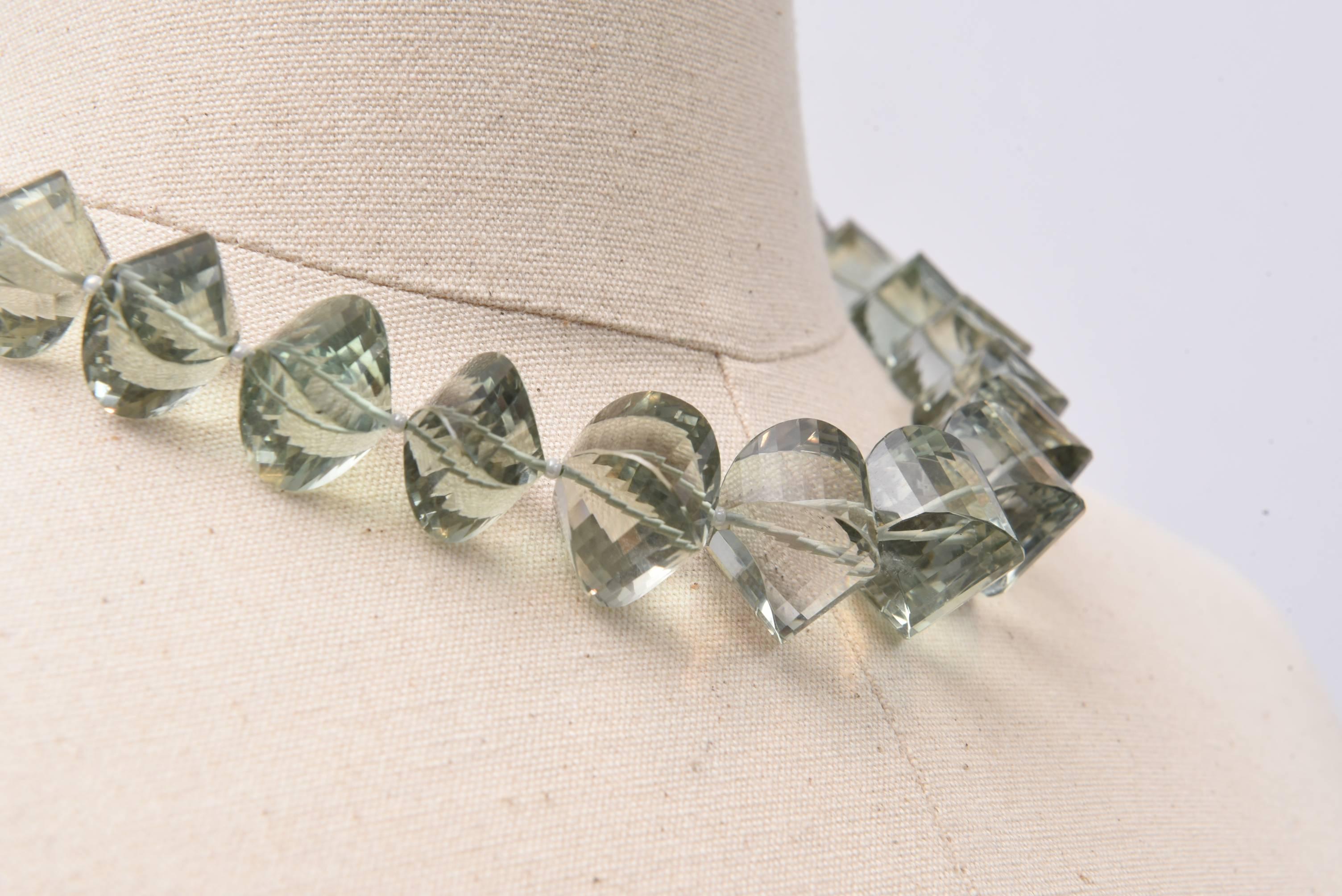 A really lovely cut of stone, a faceted cushion cut green amethyst (prasiolite) graduated, beaded necklace with seed pearls in between with sterling clasp and a bit of extra chain for adjust-ability.  It adds an inch to the length.  Largest bead is