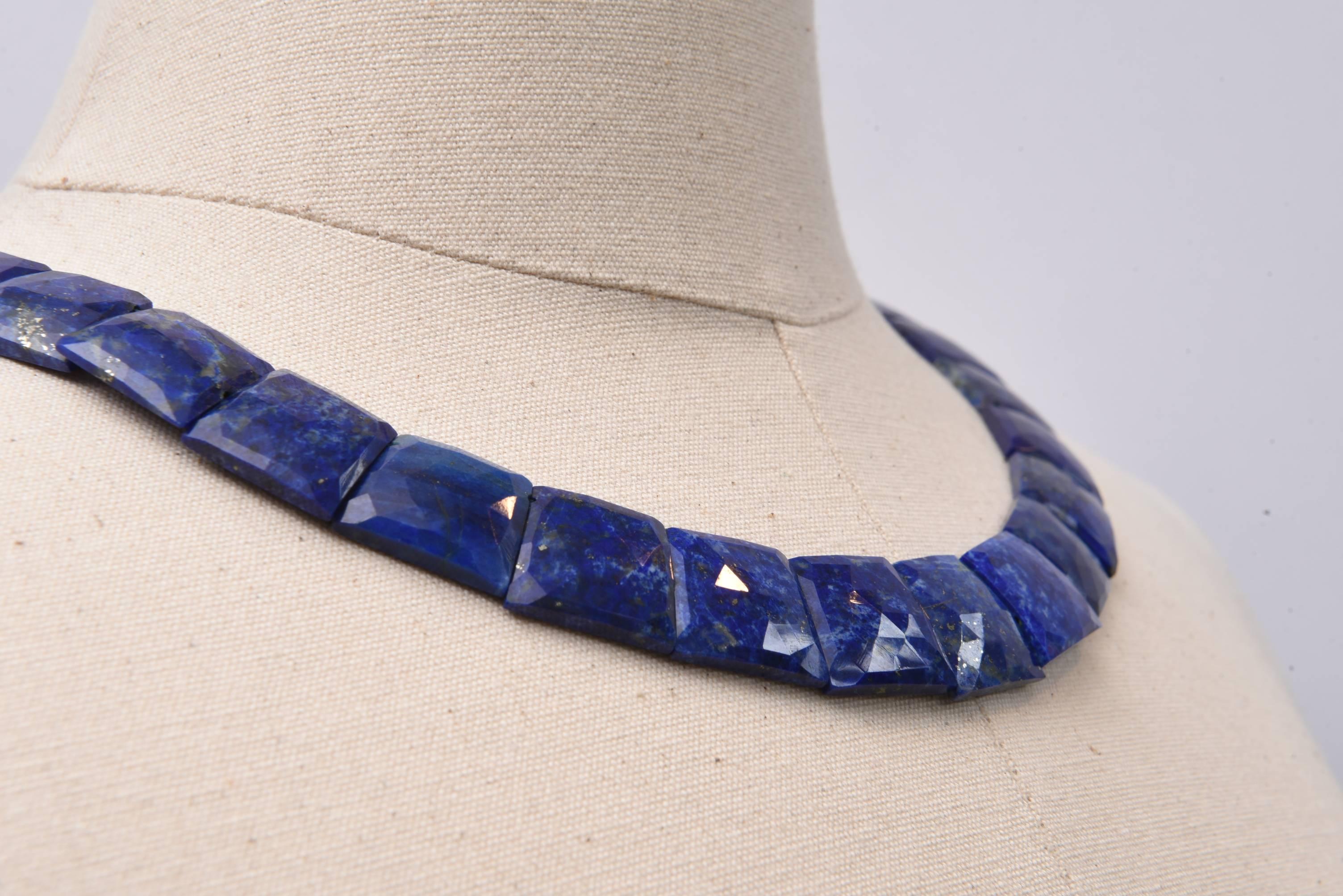 These are very unusual cuts of lapis beads, all natural in a trapezoidal shape with beveled facets on top of the stone to bring it to life.  Natural flecks of pyrite are present, as they should be.  Slightly graduated.  Fabulous peacock blue color. 