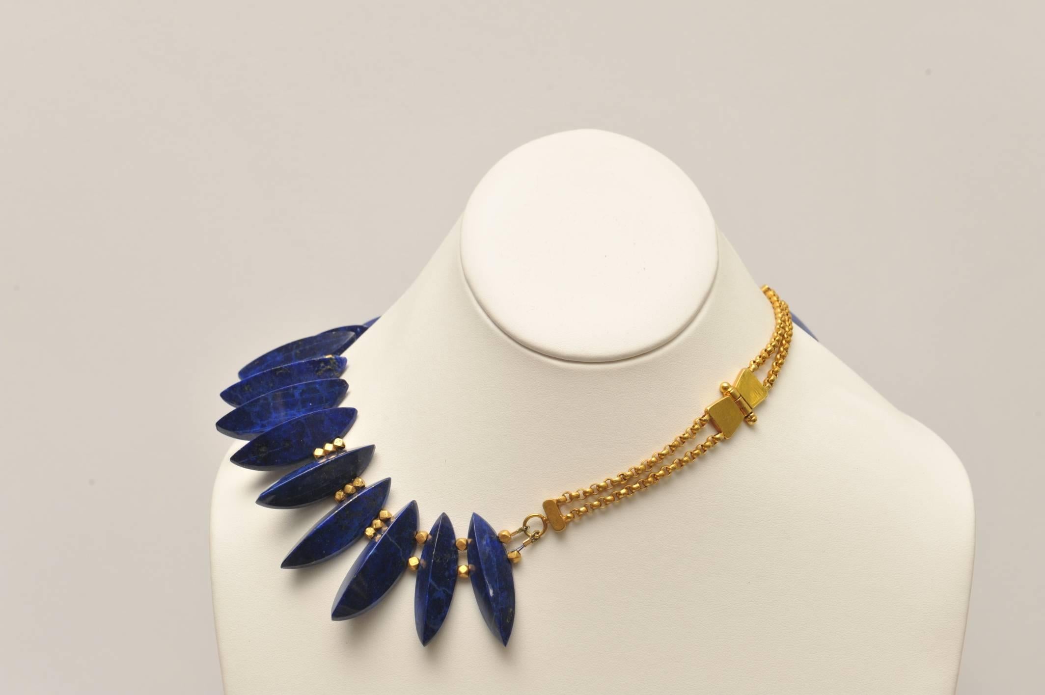 This is an impressive necklace, rare and unusual cut of the natural lapis lazuli with amazing color and flecks of pyrite natural to all un-dyed lapis.  Strung with 22K gold spacers and a double gold chain with a screw clasp.   The longest stone is