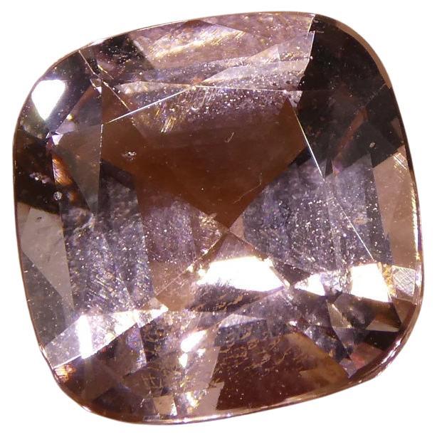 This is a stunning GIA Certified Morganite 

The GIA report reads as follows:

GIA Report Number: 5201973651
Shape: Cushion
Cutting Style: 
Cutting Style: Crown: Brilliant Cut
Cutting Style: Pavilion: Step Cut
Transparency: Transparent
Color: Orangy