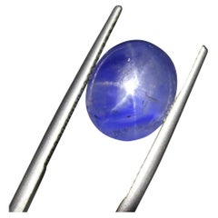 Saphir bleu étoilé cabochon ovale 11.29 carats certifié GIA   
