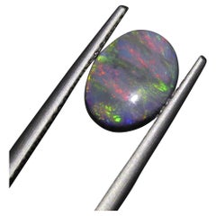 Cabochon ovale en opale noire certifiée GIA de 1.42 carat