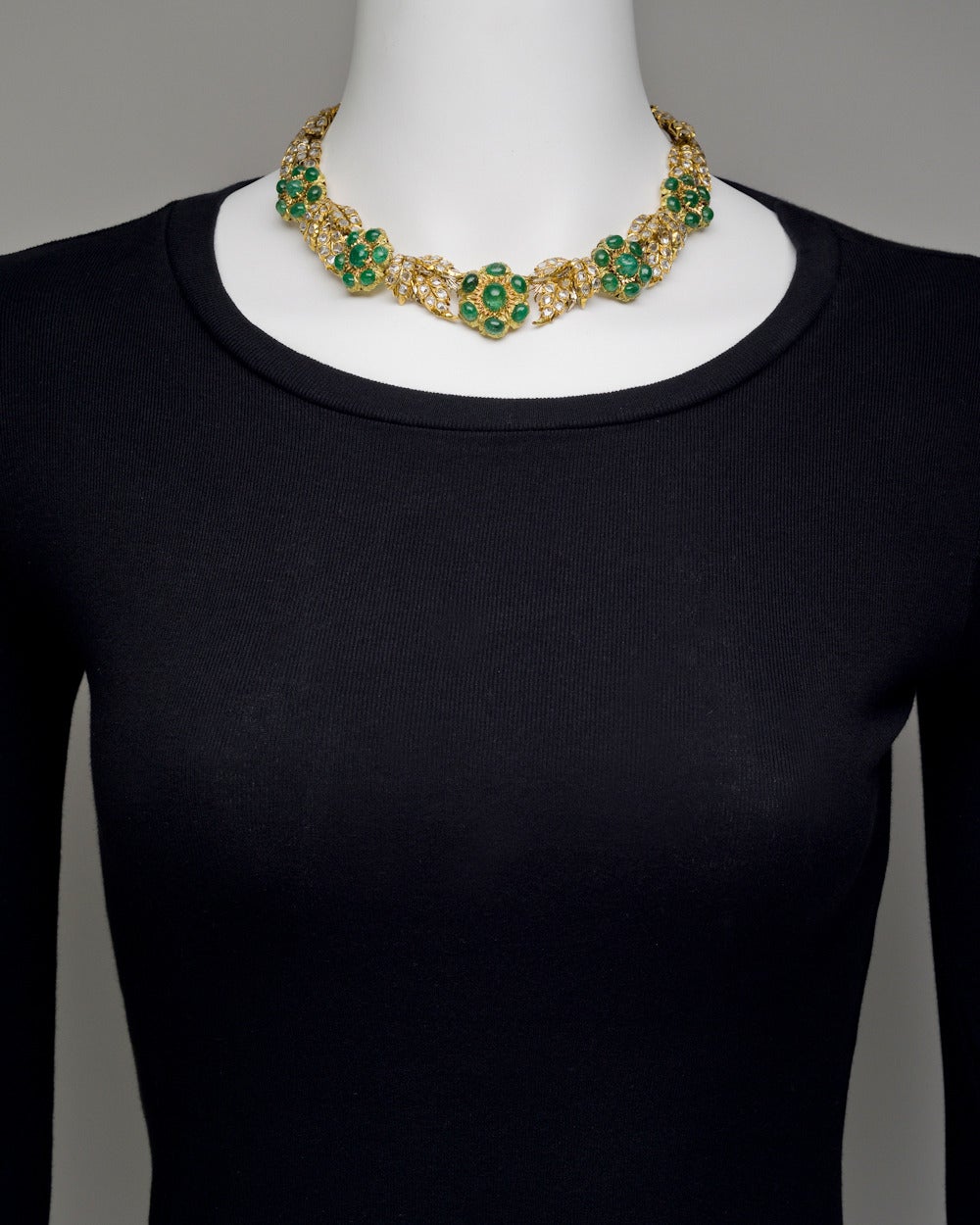 Cabochon-cut emerald and rose-cut diamond leaf necklace, designed as rose-cut diamond-set foliate panels, further accented by five cabochon-cut emerald florets, mounted in 18k yellow gold, the emeralds weighing approximately 22.00 total carats and