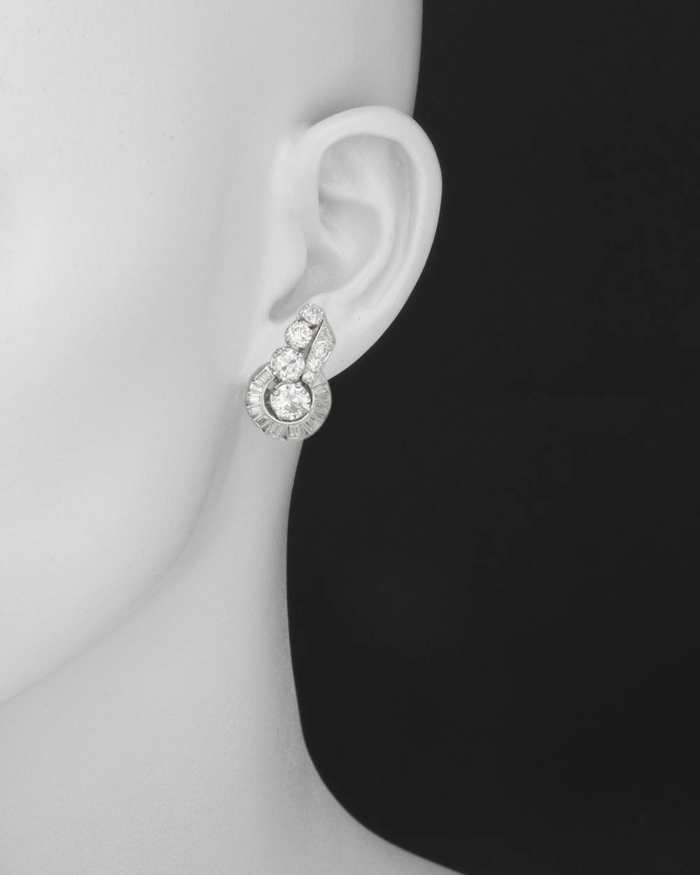 Diamond spray earclips, showcasing old European-cut and baguette-cut diamonds, the diamonds weighing approximately 8.32 total carats, with French hallmarks, mounted in platinum. 1