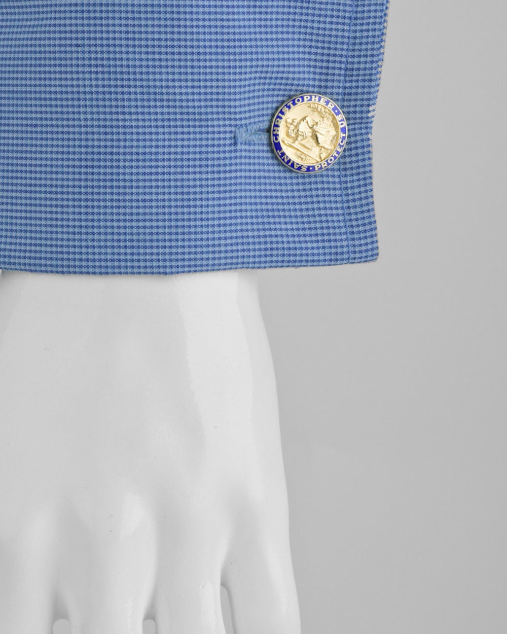 St. Christopher cufflinks in 14k yellow gold with blue enamel border and leverbacks. Inscribed 