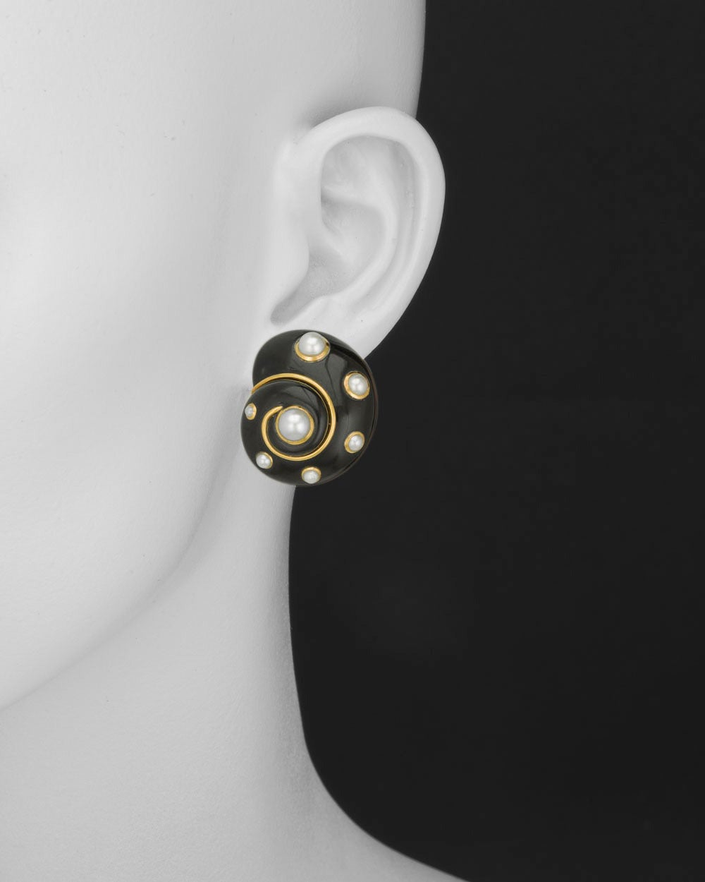 Black jade spiral snail shell earclips with round, freshwater pearl bead accents set in 18k yellow gold mounts, with clip backs, signed Verdura.