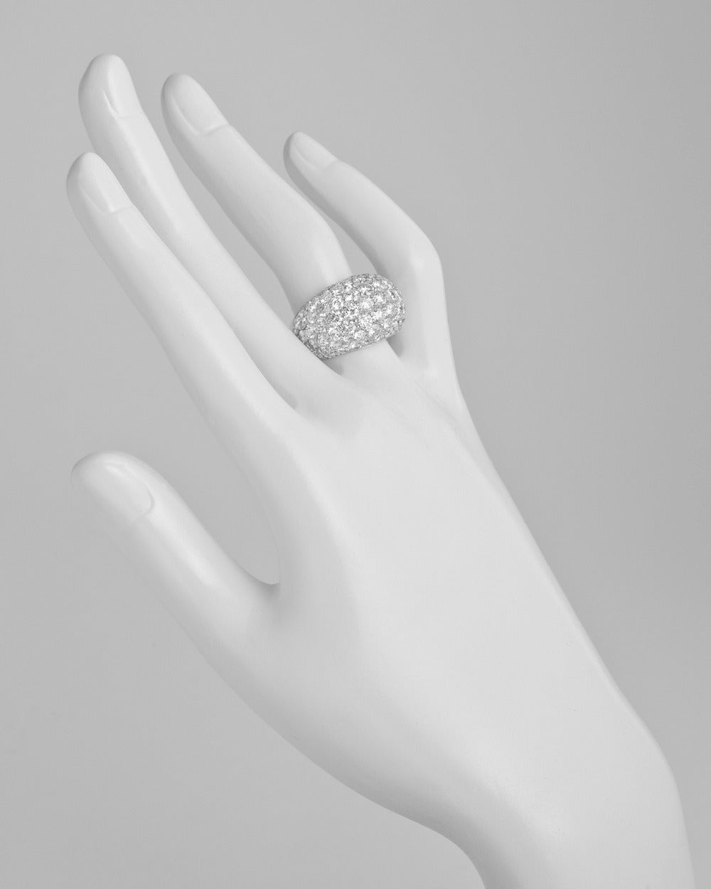 Pave diamond dome ring, set with 7-rows of near-colorless round diamonds weighing approximately 5.60 total carats (F-G color/VS-SI clarity), mounted in platinum. Size 6.25.