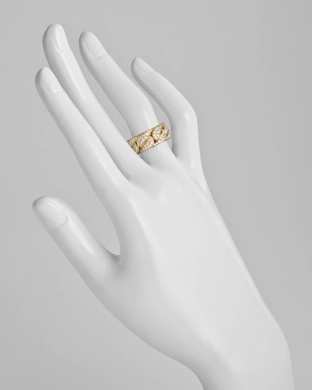 "La Dona" band ring, showcasing pavé-set diamond geometric links, in 18k yellow gold, numbered NW1751, signed Cartier. 8mm band width. Size 5.75 (European - 51).
