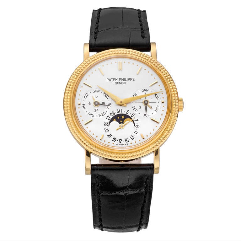 Patek Philippe 18k yellow gold perpetual calendar wristwatch, Ref. 5039J, featuring the 240 Q movement, 27 jewels, 22k yellow gold mini-rotor, Geneva Seal, silvered dial with applied baton indexes, three subsidiary dials indicating month combined