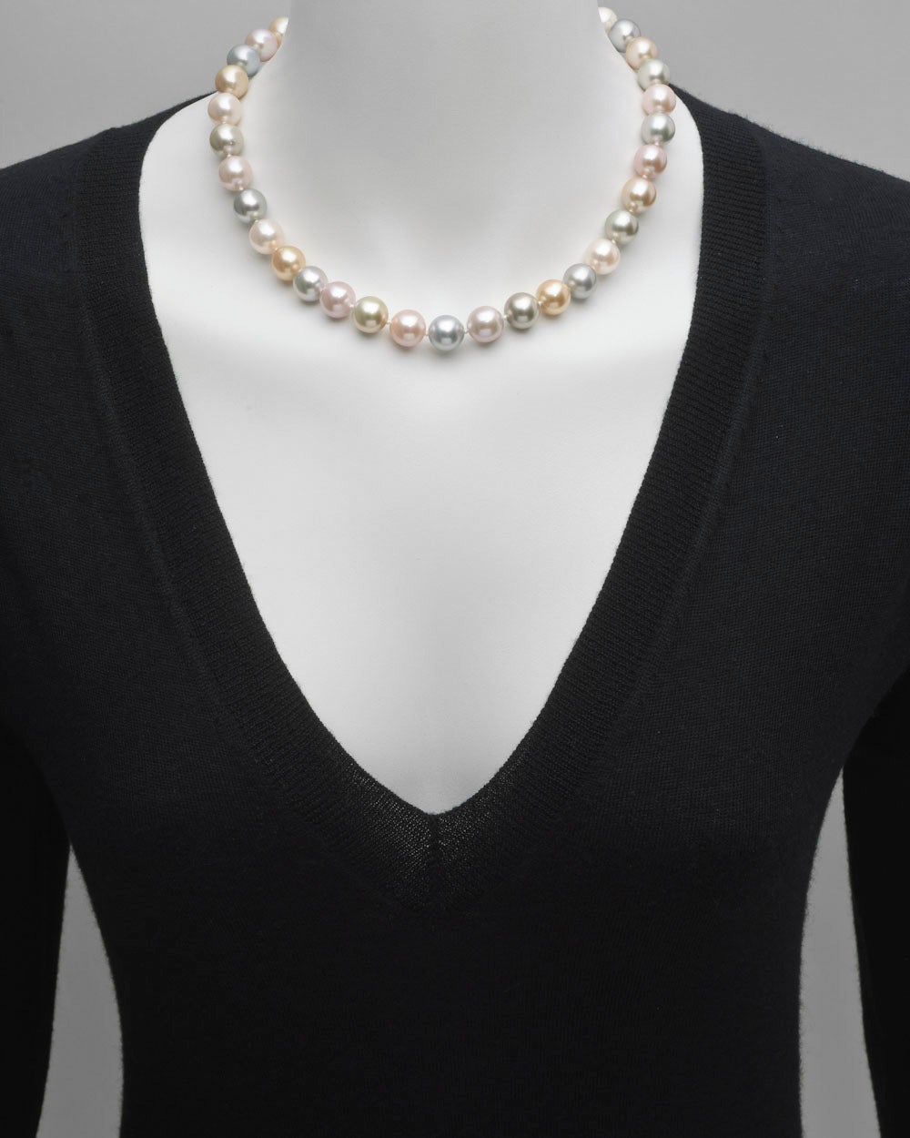 Multicolored Tahitian pearl necklace, composed of 37 pastel colored pearls, ranging from 10 to 11.5mm in diameter, strung on a silk cord, with a pavé diamond ball clasp in 18k white gold. 18