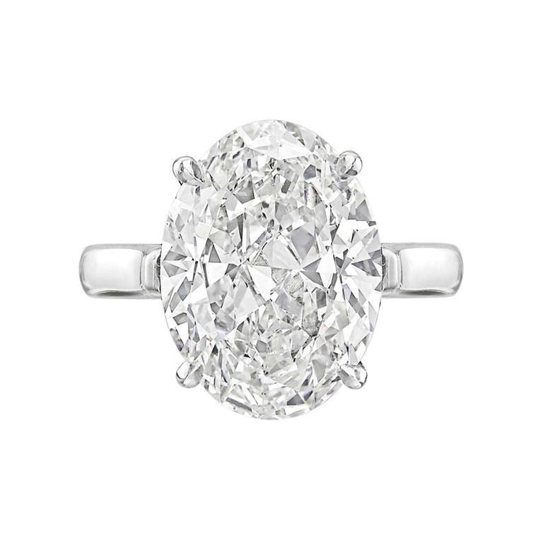 Diamond solitaire engagement ring, centering on an oval-cut diamond weighing 5.41 carats, mounted in a classic four-prong platinum setting. Accompanied by a GIA certificate for the diamond. Re-sizable.
Shape:	Oval
Carat Weight:	5.41 carat
Color