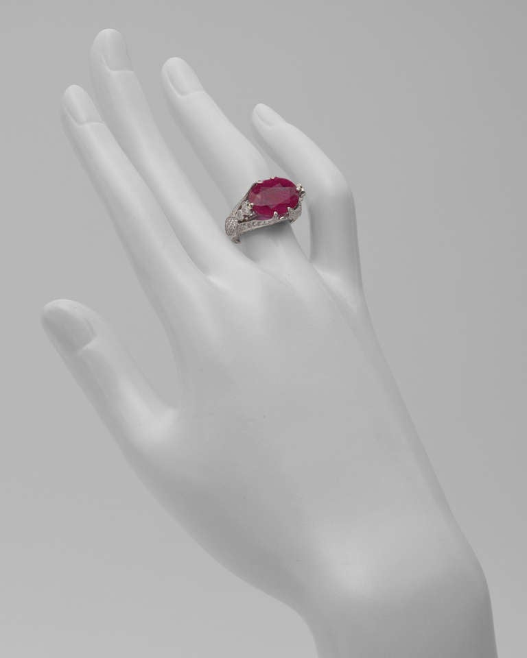 Ruby and diamond ring, centering on a natural, Burmese ruby weighing 10.02 carats, mounted in a fancy platinum setting accented by pavé diamond-set prongs and a partway pavé diamond split shank. Size 5 (re-sizable). Signed Sophia