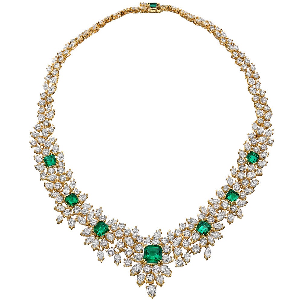 Magnificent emerald and diamond suite of jewelry, comprising a necklace, bracelet and earrings, the necklace designed with a front section composed of seven octagonal-shaped step-cut emeralds surrounded by pear-shaped, marquise-shaped and