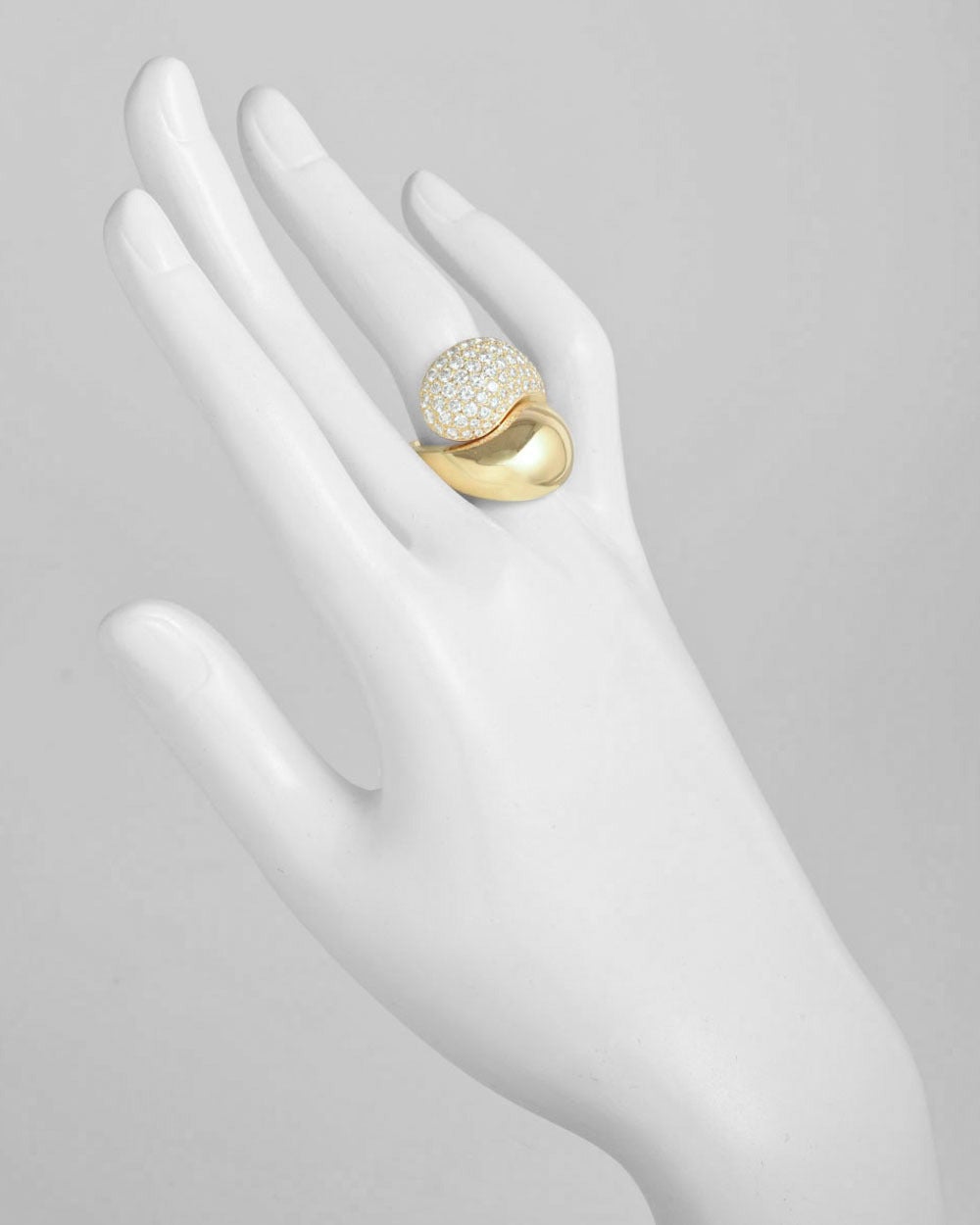 Bypass ring in polished 18k yellow gold with pavé diamonds, the diamonds weighing approximately 2.64 total carats, numbered 817856, signed Cartier. Size 7.5 (56 - European).