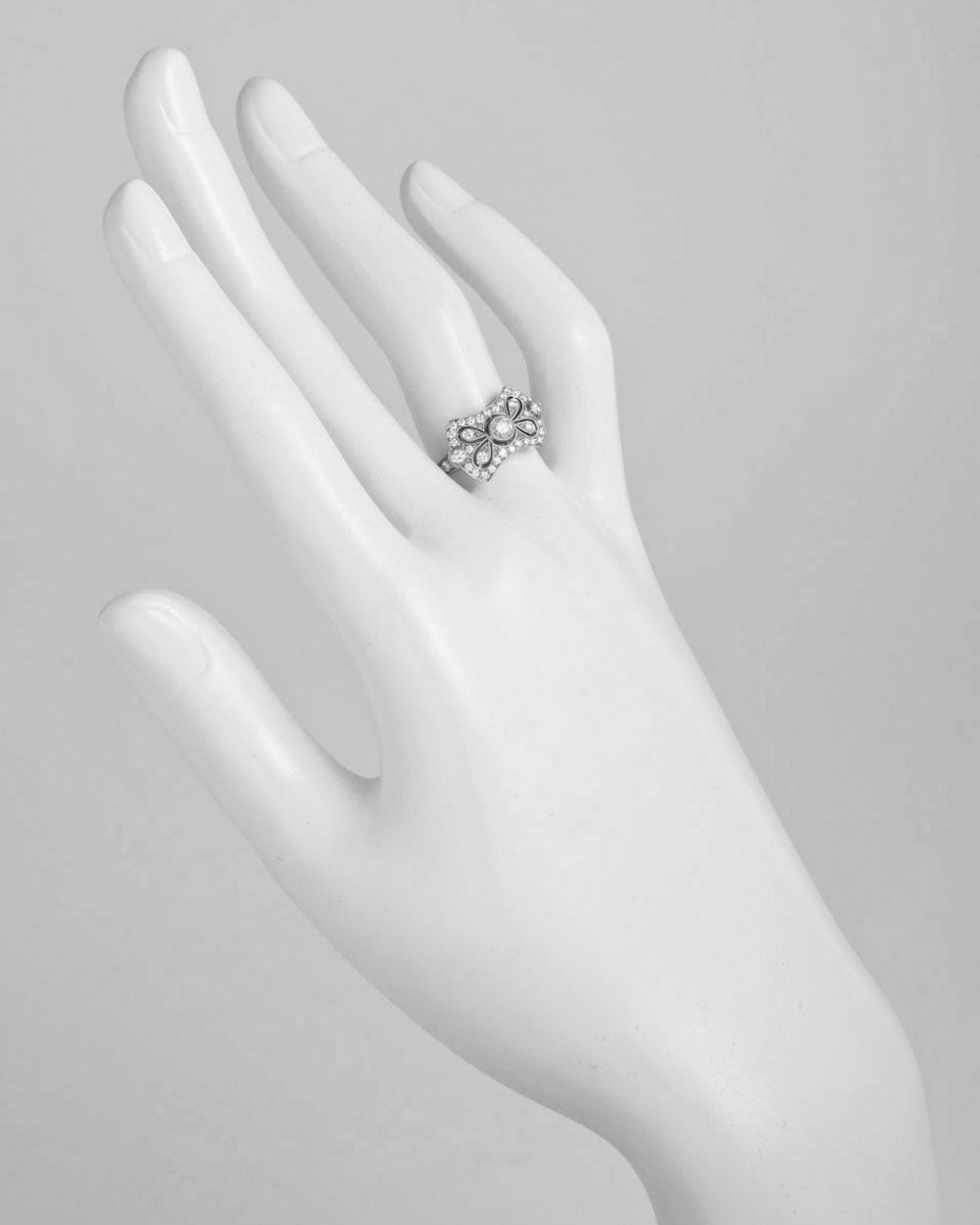 Diamond bow dress ring, from Kwiat's 'Vintage' collection, set with approximately 0.50 total carats of round diamonds (G-H color/VS1-VS2 clarity), mounted in 18k white gold, signed Kwiat. Size 7.