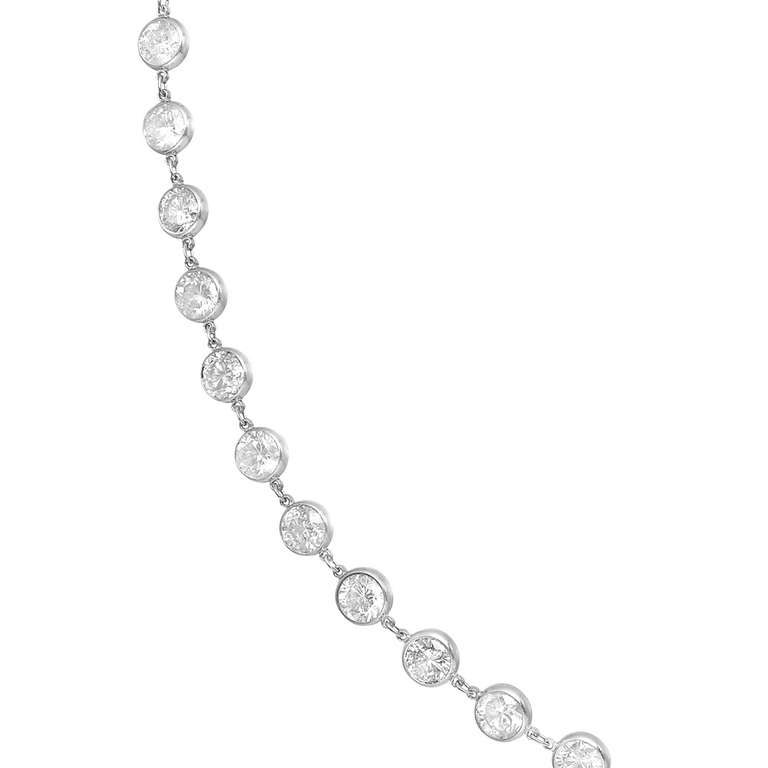 Bezel-set diamond chain long necklace, set with 122 circular-cut diamonds weighing approximately 50 total carats, mounted in platinum. 42