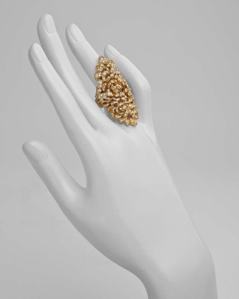 Elongated stylized foliate cocktail ring, set with round diamonds weighing approximately 3.00 total carats, mounted in an openwork 18k yellow gold setting, signed Repossi. Size 7.