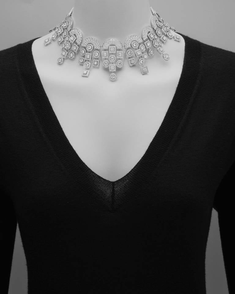 Art Deco-style “Salome” collar necklace, designed as a series of arches suspending arrangements of circular and square motifs, set with 52 princess-cut diamonds weighing approximately 18.38 total carats and 2,457 round-cut diamonds weighing