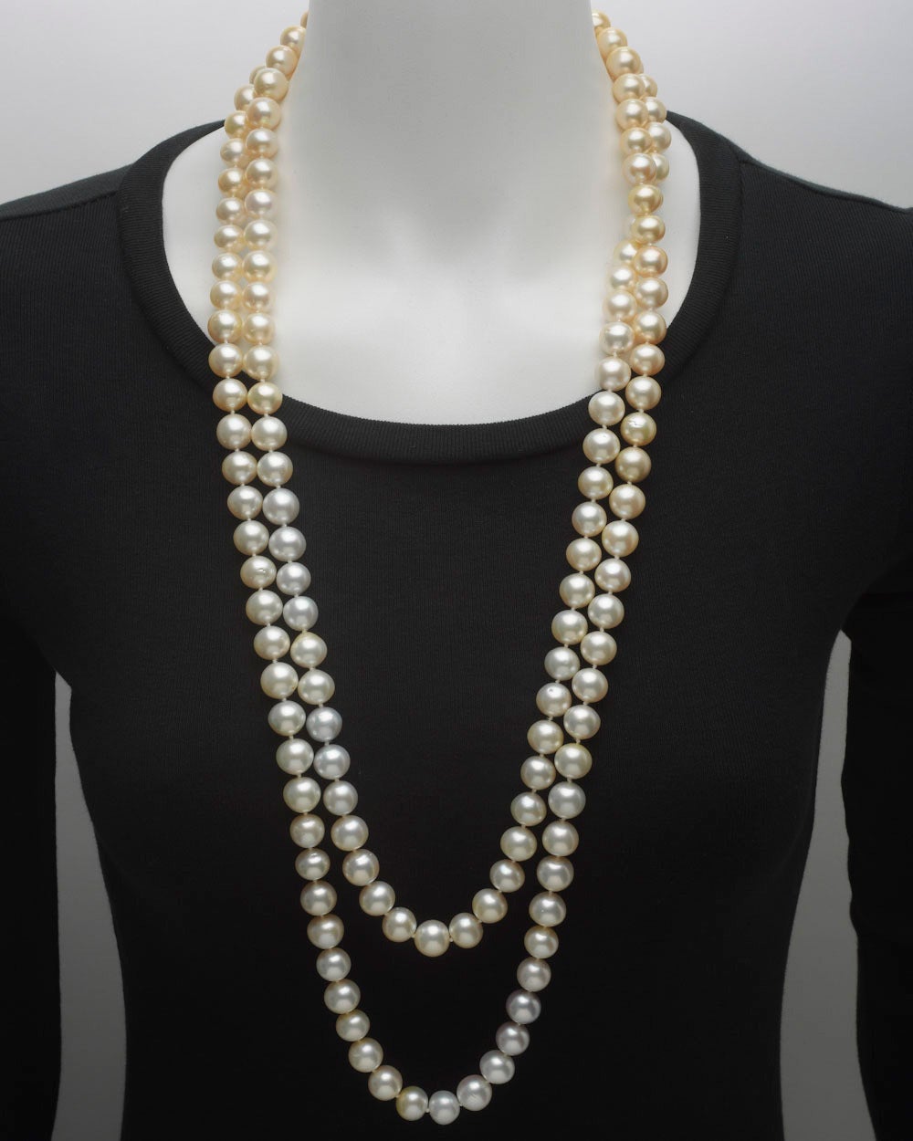 Cultured South Sea pearl long wrap necklace, composed of 146 multicolored South Sea pearls with diameters ranging from 12mm to 11mm, the pearls slightly baroque in shape with colors ranging from golden yellow and creamy white to slightly bluish