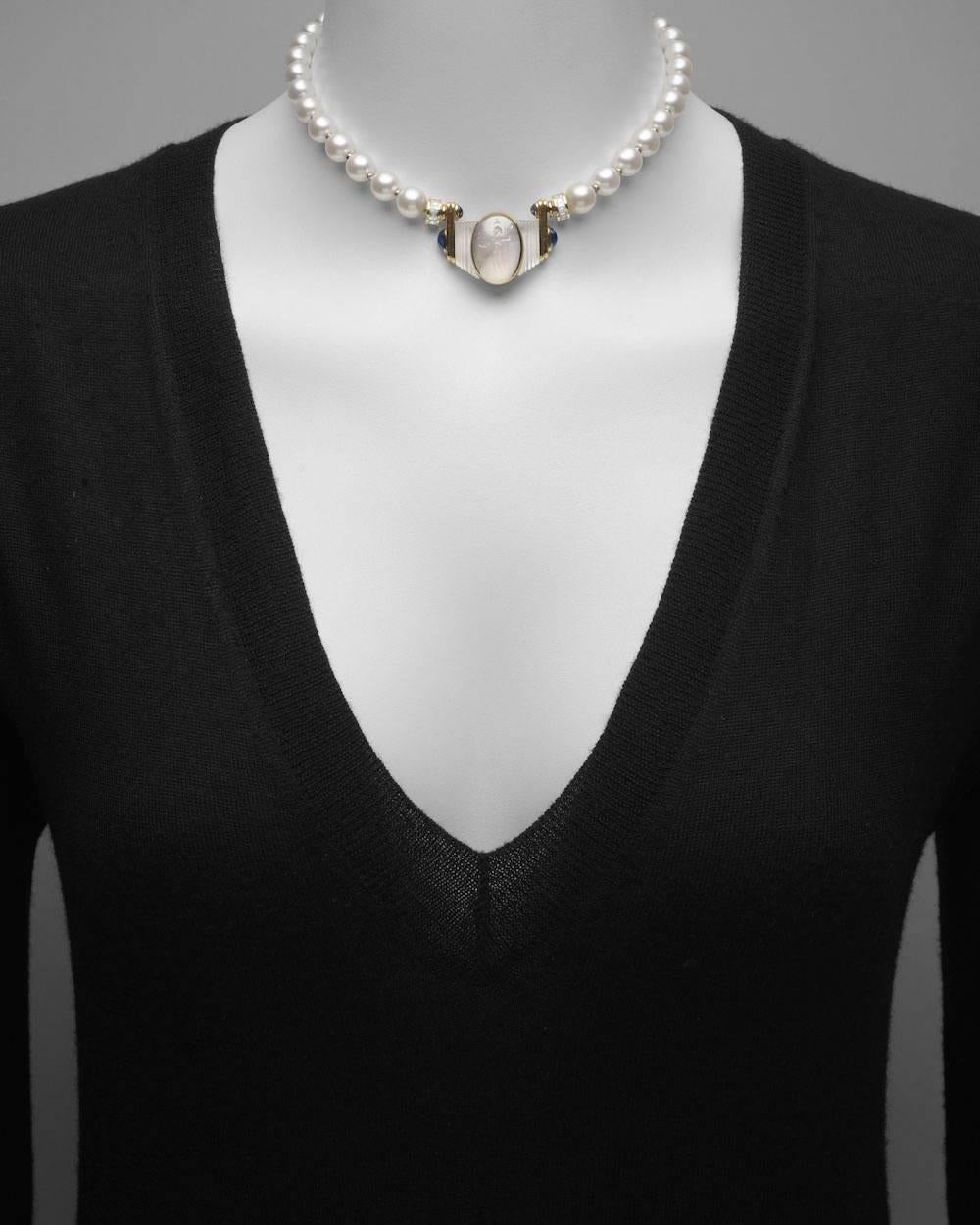 Cultured pearl choker necklace, centering on a carved oval-shaped chalcedony intaglio of an athlete, circa II century A.D., the intaglio bezel-set in 18k yellow gold and suspended in a ribbed and frosted rock crystal panel, the panel accented by