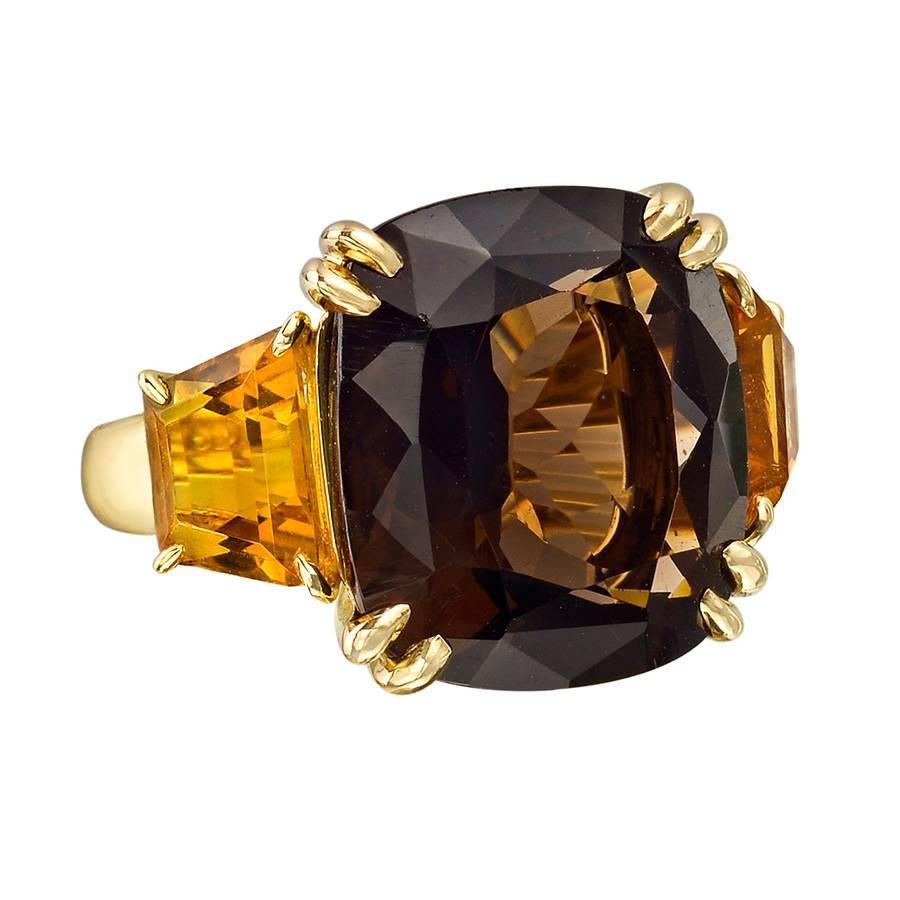 
Smoky quartz and citrine three-stone ring in 18k yellow gold, numbered 15681, signed Seaman Schepps. Size 5.75.