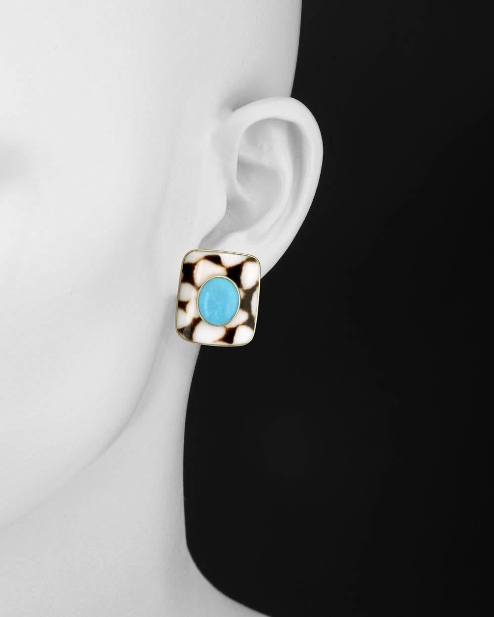 Cushion-shaped antique marble cone shell earclips with oval-shaped cabochon turquoise centers, mounted in 18k yellow gold, with omega clip backs, numbered 27591, signed Trianon. 1.05