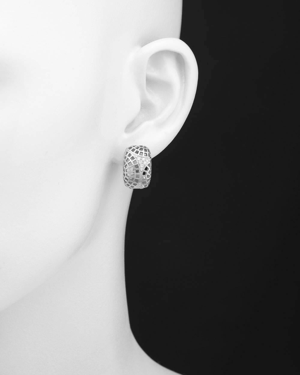 Filigree half-hoop earrings, accented by triangular-shaped pavé diamond sections at top and bottom, the diamonds weighing approximately 0.27 total carats (F-G color/VVS1-VVS2 clarity), in 18k white gold, with clips and post backs, numbered I23771,