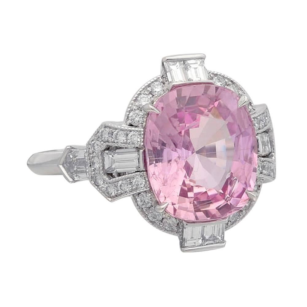 Pink sapphire and diamond ring, centering a natural cushion-cut pink sapphire weighing 6.22 carats, accented by a fancy-cut diamond surround including two bullet-cut diamonds weighing 0.34 total carats, six baguette-cut diamonds weighing 0.43 total