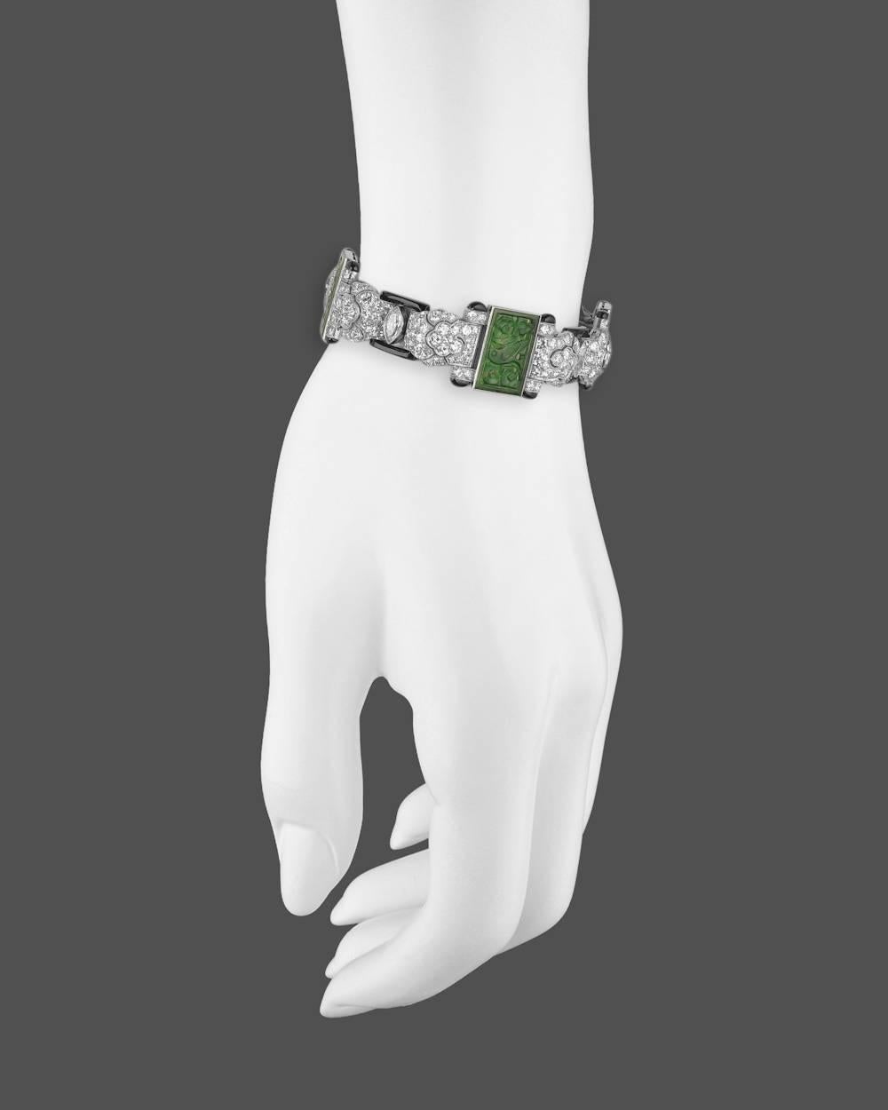 Very fine Art Deco gem-set panel bracelet, showcasing four pierced jadeite plaques framed by four larger marquise-shaped diamonds weighing approximately 1.20 total carats and 256-round diamonds weighing approximately 7.70 total carats, with black