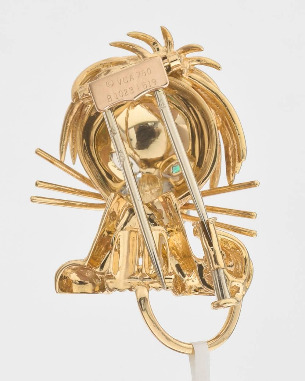 Small whimsical lion cub brooch, in intricately crafted 18k yellow gold and platinum, with pavé-set diamond muzzle, circular-cut emerald eyes and black enamel nose, numbered 1023 1619, signed 'VCA' for Van Cleef & Arpels. Diamonds weighing